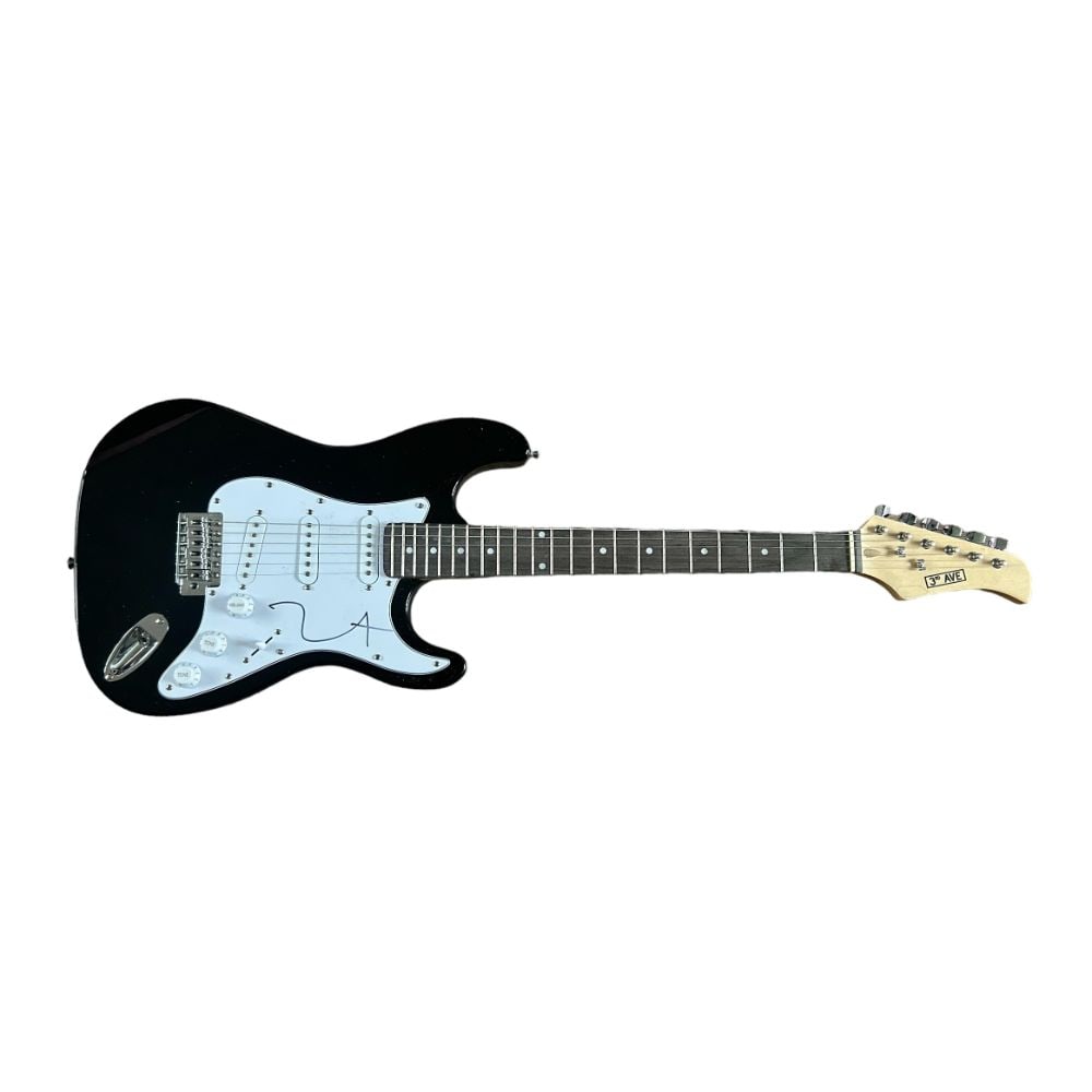 Kanye West Signed Electric Guitar: This lot is a black Stratocaster style guitar autographed on the pickguard by Kanye West. Ye (born Kanye Omari West, June 8, 1977) is an American rapper, singer, songwriter, record producer, and fashi