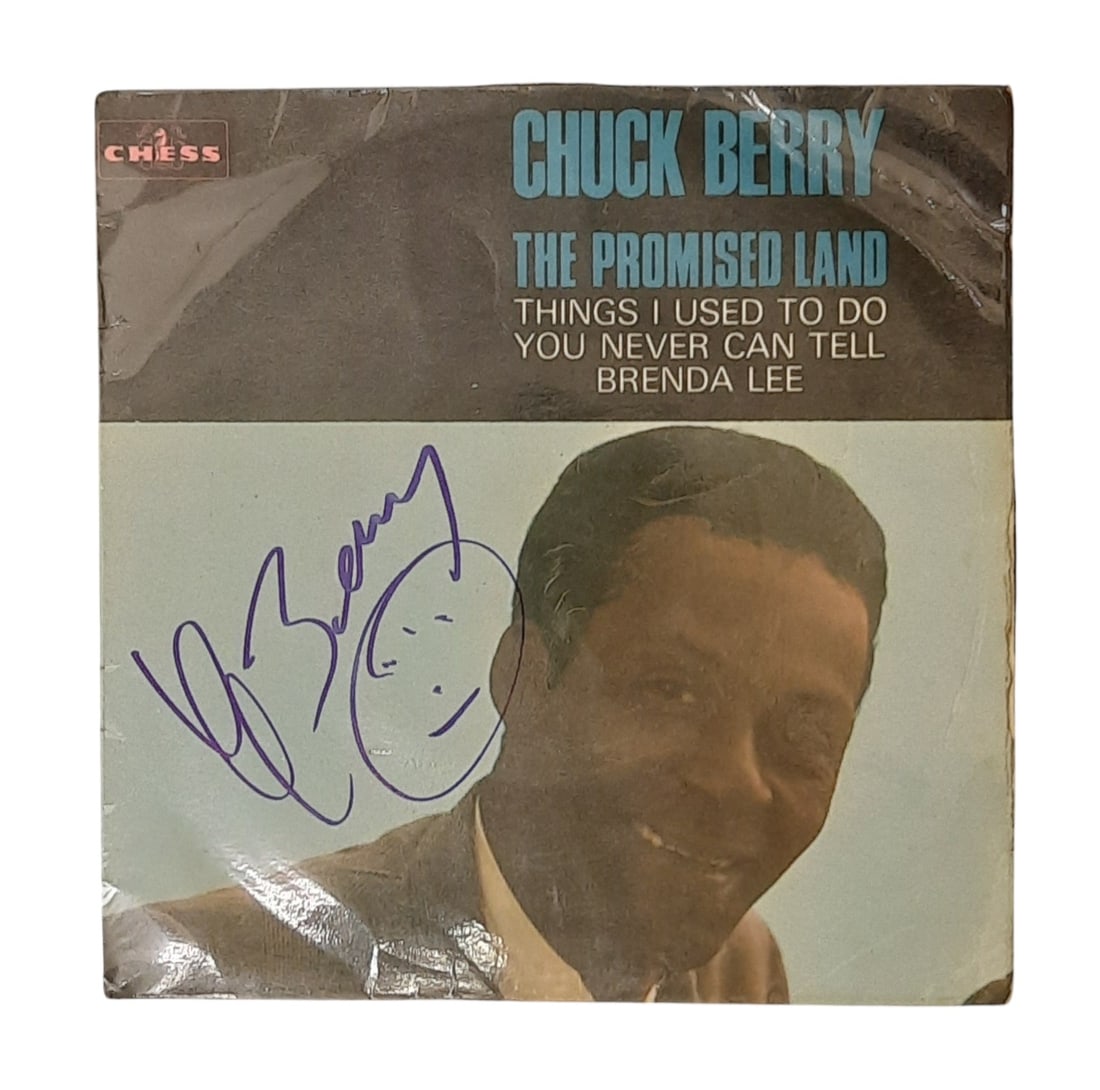 Chuck Berry Signed 7" Vinyl: This lot is a 7" vinyl (The Promised Land) autographed by Chuck Berry. Item comes with third-party authentication and affixed tamper-proof holographic QR sticker leading to item details and scoring.