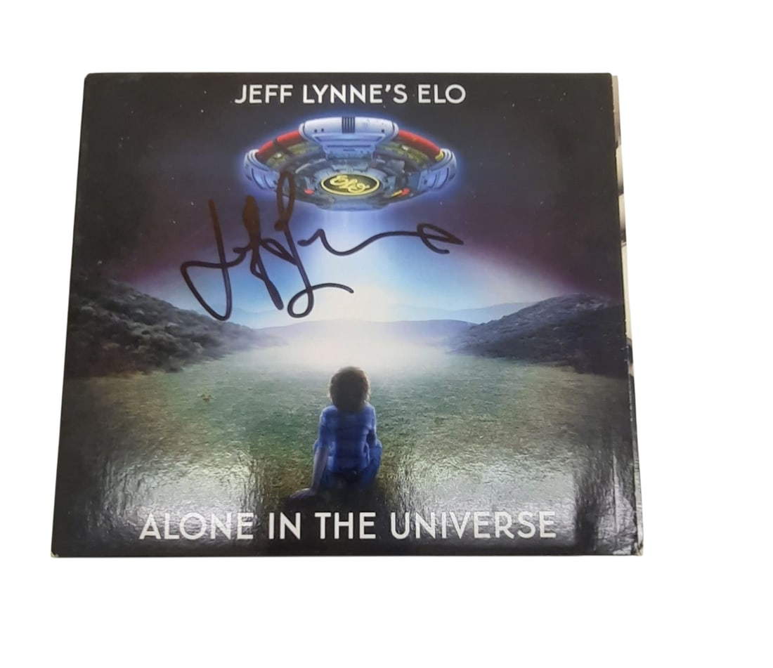 Jeff Lynne ELO Signed CD: This lot is a signed CD (Alone In The universe), autographed on the front of the CD sleeve by Jeff Lynne of ELO. Item comes with third-party authentication and affixed tamper-proof holographic QR stic