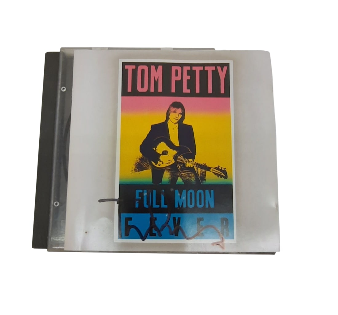 Tom Petty Signed CD: This lot is a signed CD (Full Moon Fever), autographed on the front of the CD sleeve by Tom Petty. Item comes with third-party authentication and affixed tamper-proof holographic QR sticker leading to