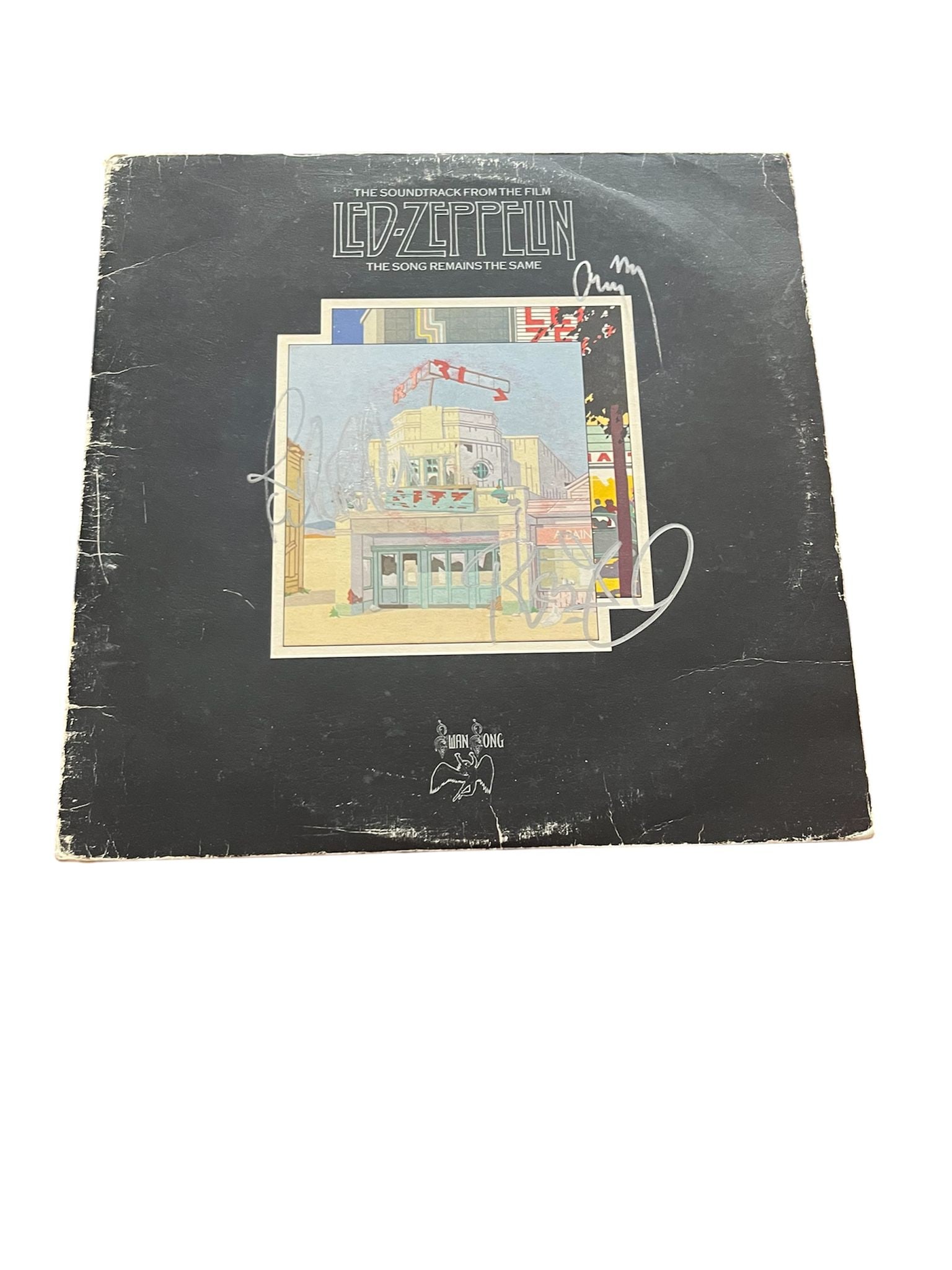 Led Zeppelin Signed Vinyl LP: This lot is a vinyl LP (The Song Remains The Same), autographed on the front of the vinyl cover by Robert Plant, Jimmy Page and John Paul Jones of Led Zeppelin. Item comes with third-party authenticat