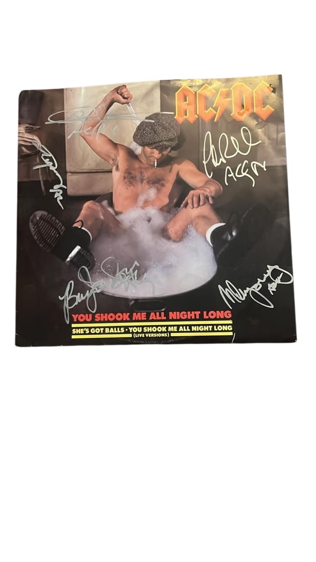 AC/DC Signed 12" Vinyl: This lot is a 12" vinyl (You Shook Me All Night Long), autographed on the front of the vinyl cover by Brian Johnson, Angus Young, Malcolm Young, Cliff Williams and Phil Rudd of AC/DC. Item comes with 