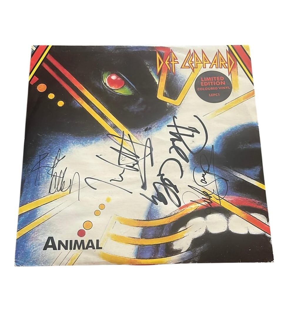 Def Leppard Signed 12" Limited Edition Colour Vinyl: This lot is a 12" limited edition colour vinyl (Animal), autographed on the front of the vinyl cover by Joe Elliott, Rick Savage, Rick Allen and Phil Collen of Def Leppard. Item comes with third-party