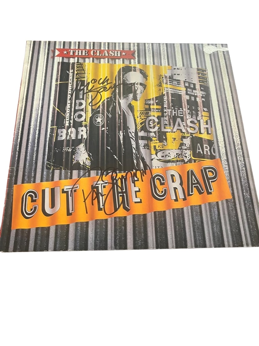 The Clash Signed Vinyl LP: This lot is a vinyl LP (Cut The Crap), autographed on the front of the vinyl cover by Mick Jones and Paul Simonon of The Clash. Item comes with third-party authentication and affixed tamper-proof holo