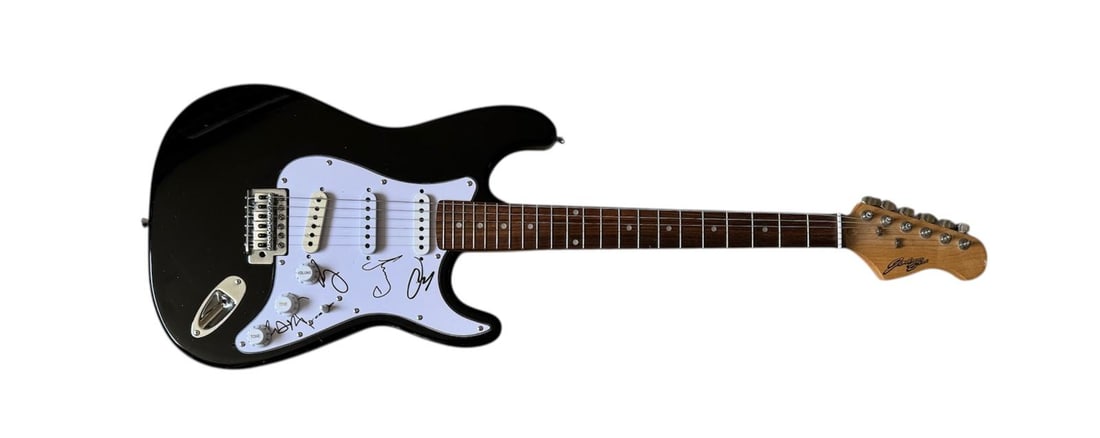 Coldplay Signed Electric Guitar: This lot is an electric guitar, autographed on the pickguard by Chris Martin, Guy Berryman, Will Champion and Jonny Buckland of Coldplay. Item comes with third-party authentication and affixed tamper-