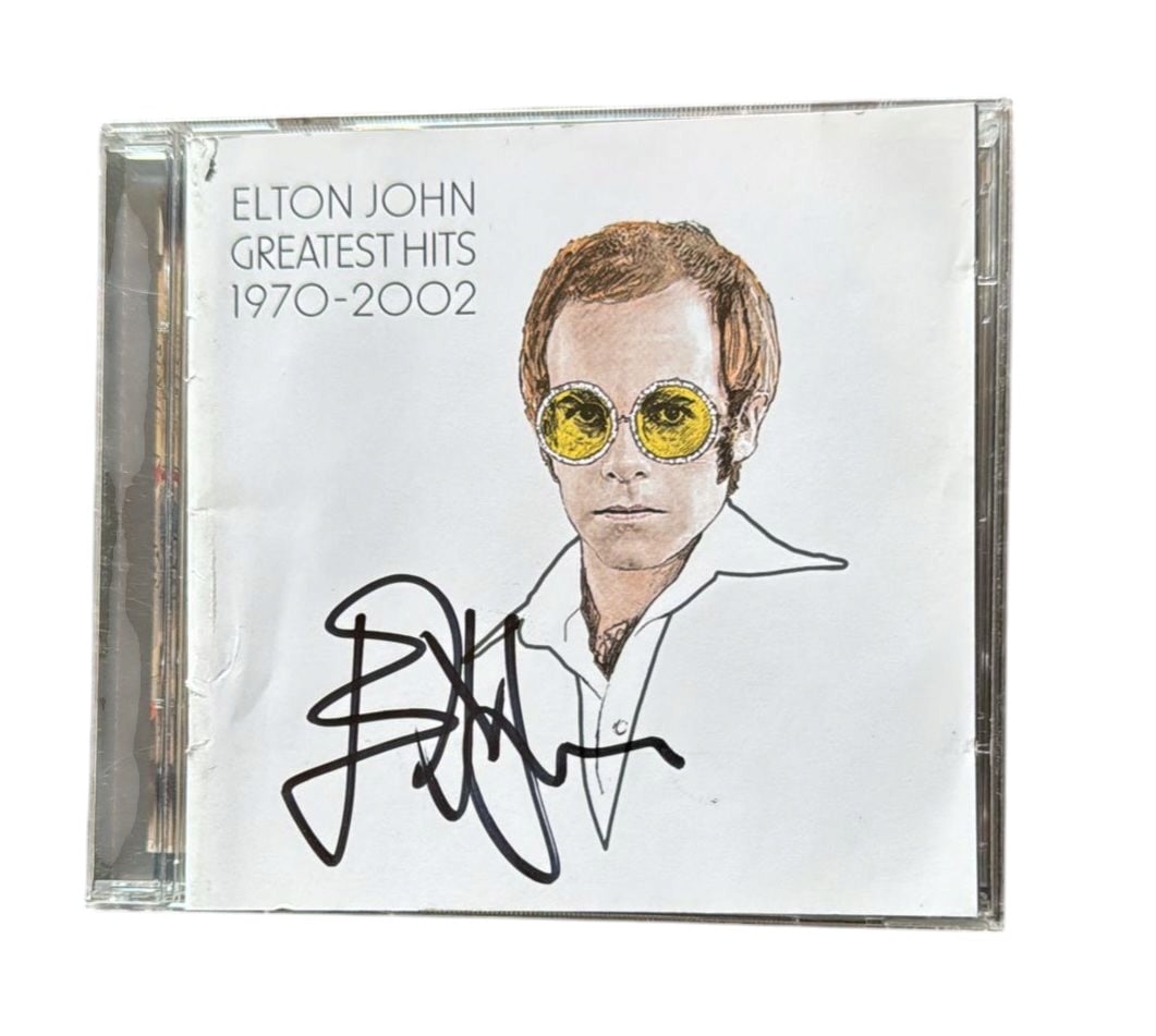Elton John Signed CD: This lot is a CD (Greatest Hits 1970-2002), autographed on the front of the CD sleeve by Elton John. Item comes with third-party authentication and affixed tamper-proof holographic QR sticker leading