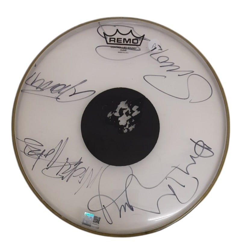 Duran Duran Signed Drumskin: This lot is a 13.5" Remo drumskin, autographed by Simon Le Bon, Nick Rhodes, John Taylor, Roger Taylor and Andy Taylor of Duran Duran. Item comes with third-party authentication and affixed tamper-pro
