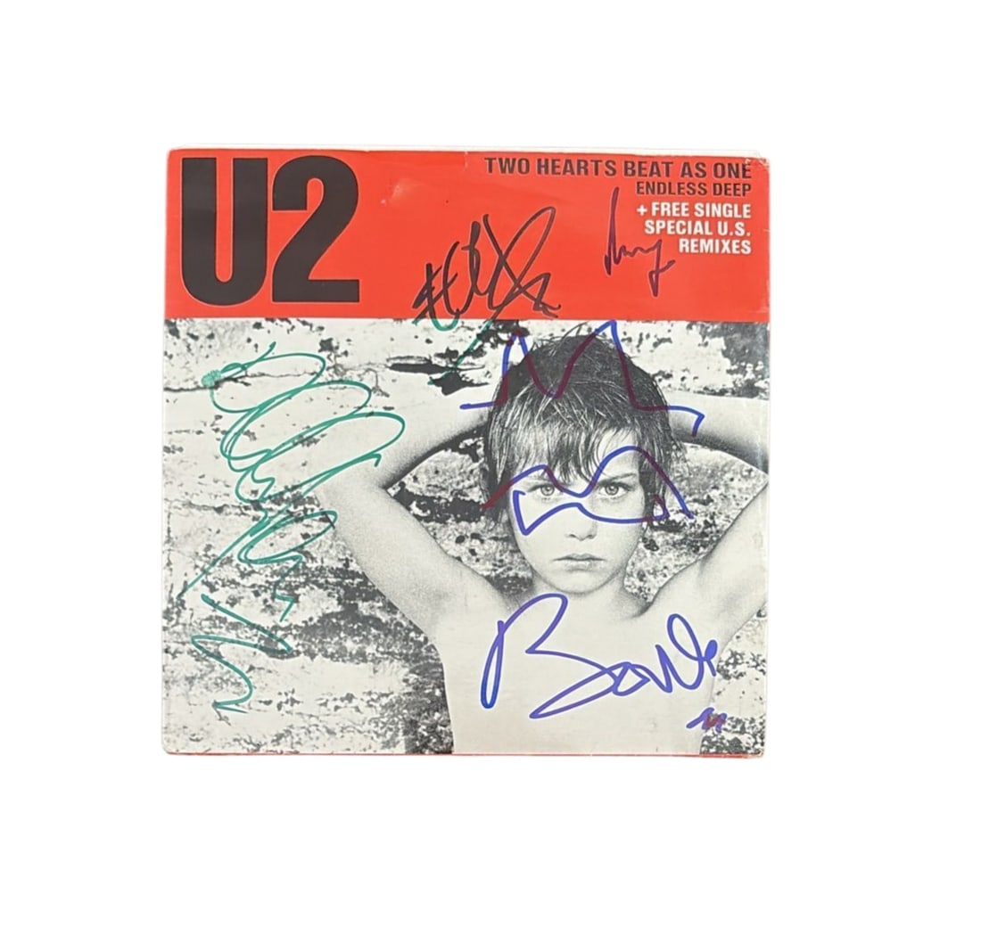 U2 Signed Vinyl 45: This lot is a vinyl 45 (Two Hearts Beat As One), autographed on the front of the vinyl cover by Bono, The Edge, Larry Mullen Jr and Adam Clayton of U2. Item comes with third-party authentication and a