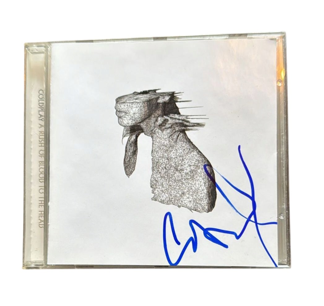 Chris Martin Coldplay Signed CD: This lot is a CD (A Rush Of Blood To The Head), autographed on the front of the CD sleeve by Chris Martin of Coldplay. Item comes with third-party authentication and affixed tamper-proof holographic Q