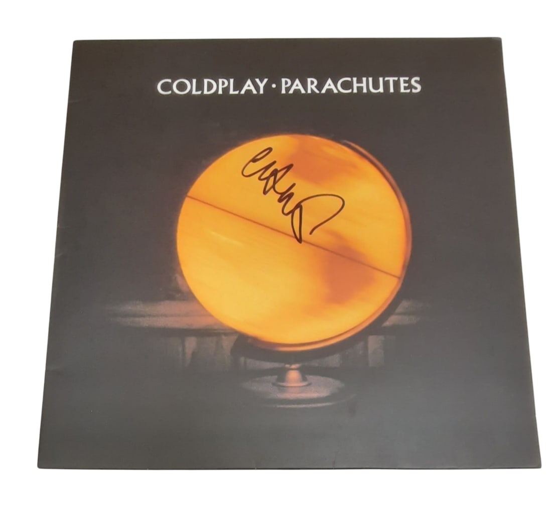 Coldplay Chris Martin Signed Vinyl LP: This lot is a vinyl LP (Parachutes), autographed on the front of the vinyl cover by Chris Martin of Coldplay. Item is authenticated by HSA and comes with affixed HSA Tamper-Proof hologram with interac