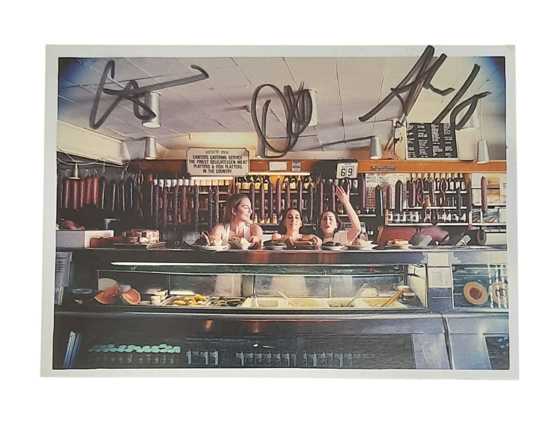 Haim Signed Postcard: This lot is a postcard, autographed by Alana Haim, Danielle Haim and Este Haim of Haim. Item comes with third-party authentication and affixed tamper-proof holographic QR sticker leading to item detai