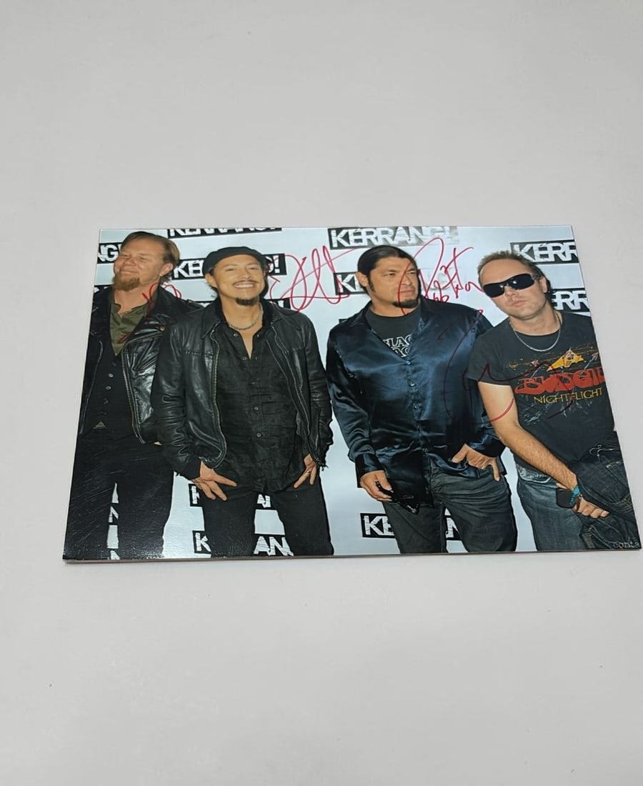 Metallica Signed Photograph: This lot is a 10x8" photograph, autographed by James Hetfield, Lars Ulrich, Kirk Hammett and Robert Trujillo of Metallica. Item comes with third party authentication including interactive QR code, ite