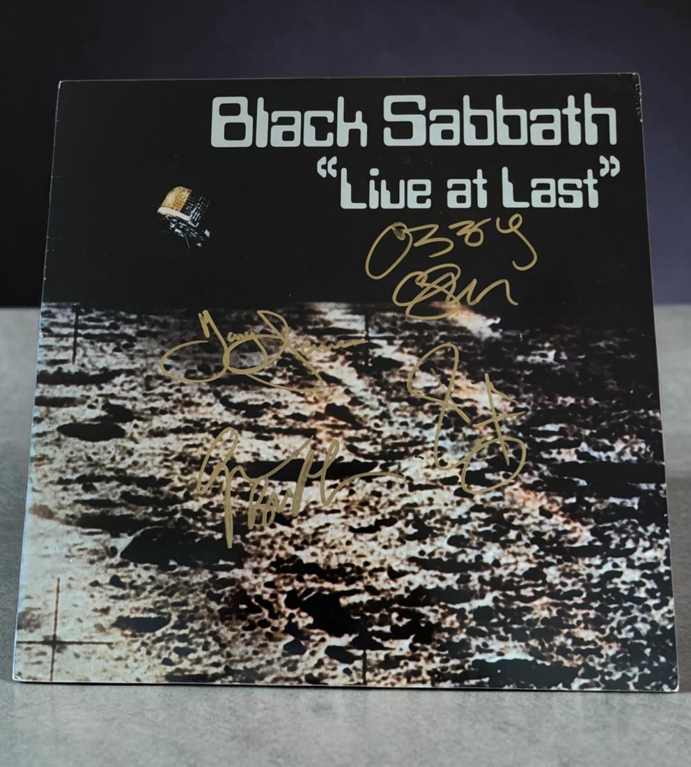 Black Sabbath Signed Vinyl LP: This lot is a vinyl LP (Live At Last), autographed by Ozzy Osbourne, Geezer Butler, Tony Iommi and Bill Ward of Black Sabbath. Item comes with third party authentication including interactive QR code,