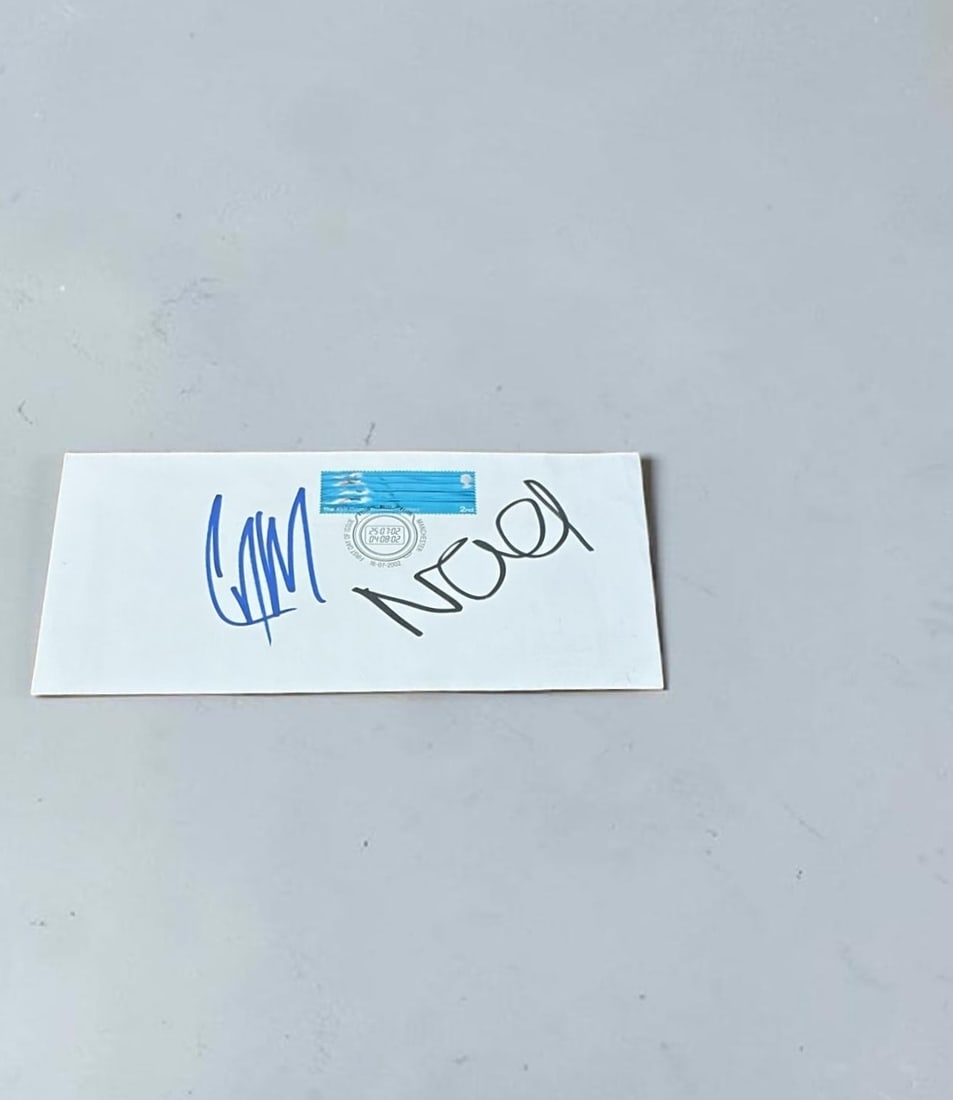 Oasis Signed Celebrity First Day Cover: This lot is a celebrity first day cover (2002), autographed by Noel Gallagher and Liam Gallagher of Oasis. Item comes with third party authentication including interactive QR code, item details and sc