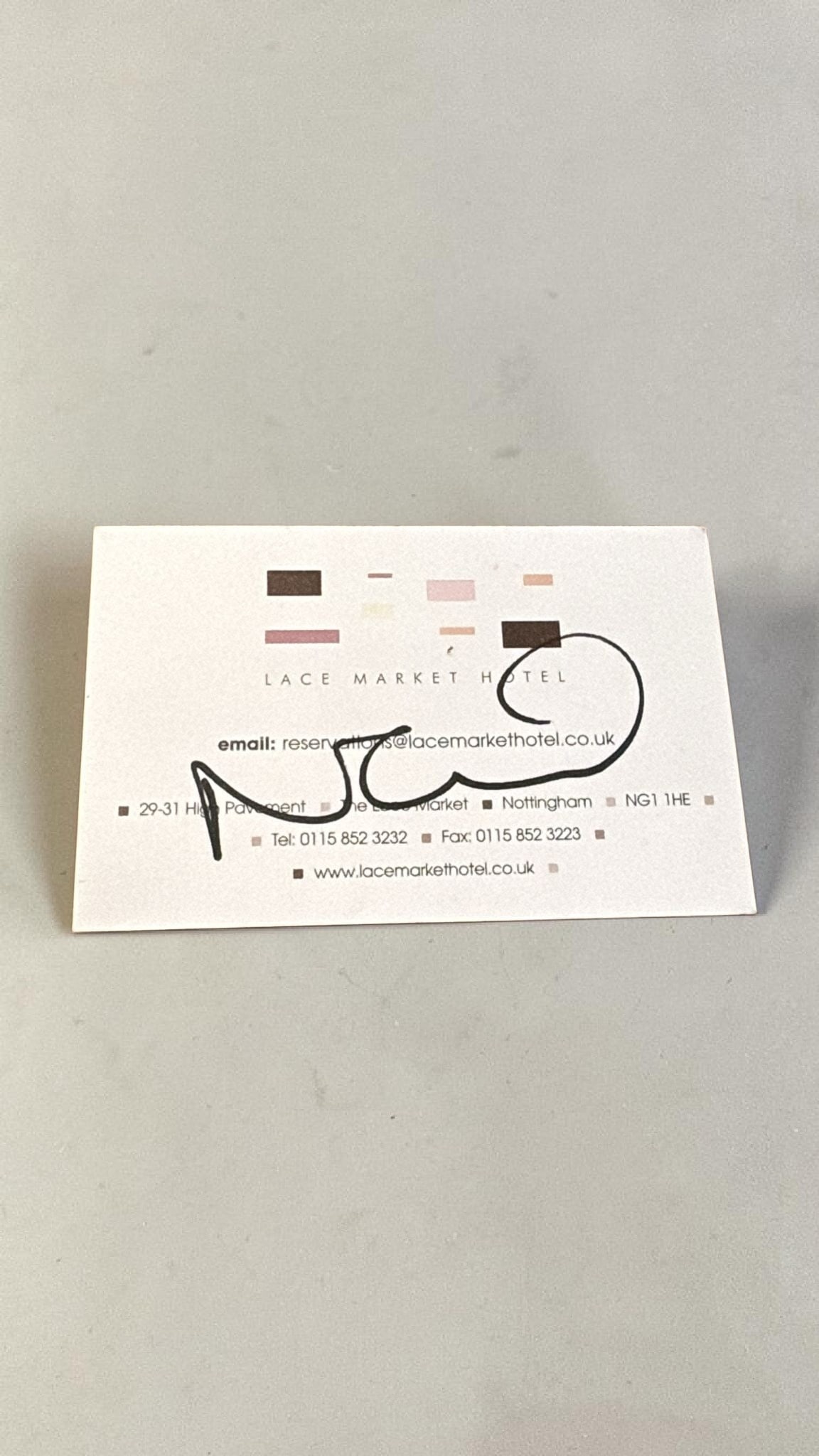 Noel Gallagher Oasis Signed Business Card: This lot is a business card (Lace Market Hotel, Nottingham), autographed by Noel Gallagher of Oasis. Item comes with third party authentication including interactive QR code, item details and scoring.