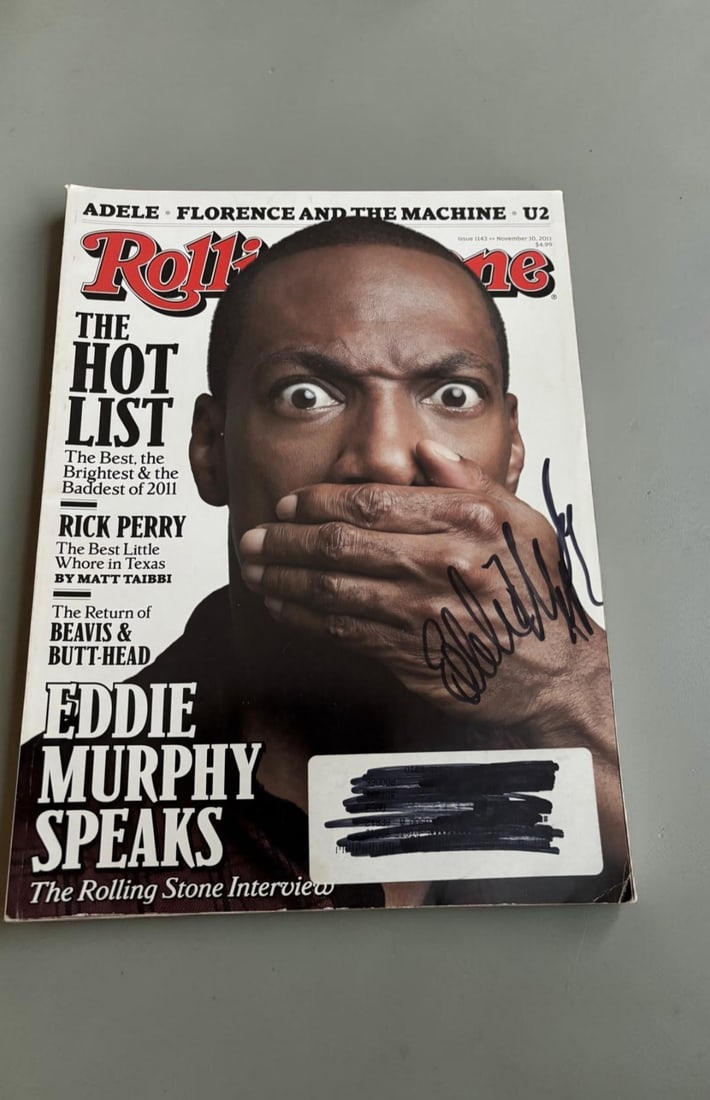 Eddie Murphy Signed Magazine: This lot is a Rolling Stones magazine (November 2011), autographed on the front cover by Eddie Murphy. Item comes with third party authentication including interactive QR code, item details and scorin