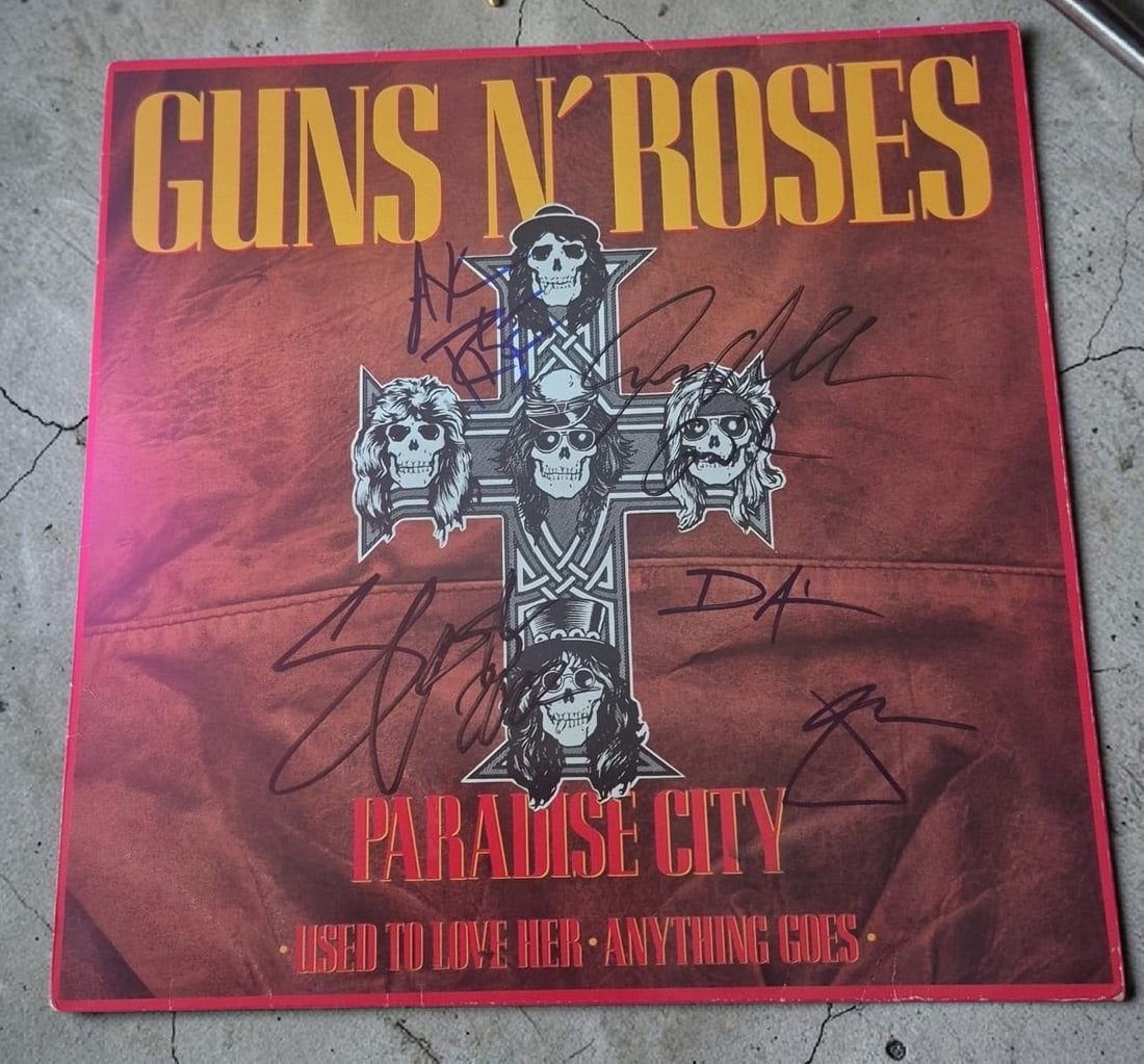 Guns N' Roses Paradise City Signed 12" Vinyl: This lot is a 12" vinyl (Paradise City), autographed by Axl Rose, Slash, Duff McKagan, Izzy Stradlin and Steven Adler of Guns N' Roses. Item comes with third party authentication including interactive