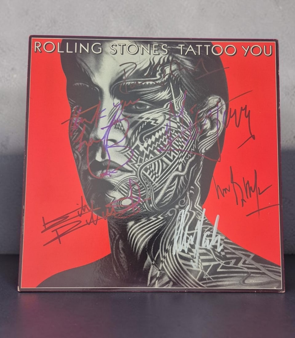 The Rolling Stones Tattoo You Fully Signed Vinyl LP: This lot is a vinyl LP (Tattoo You), autographed on the front of the vinyl cover by Mick Jagger, Keith Richards, Ronnie Wood, Charlie Watts, Bill Wyman and Mick Taylor of The Rolling Stones. Item come