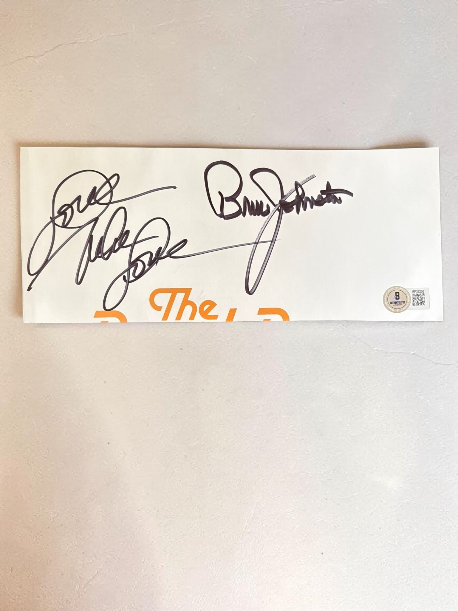 Brian Johnston And Mike Love Beach Boys Signed Cut Beckett BAS Authentication: This lot is a cut from an official book, autographed by Brian Johnston and Mike Love of The Beach Boys. Item comes with third party authentication including interactive QR code, item details and scori