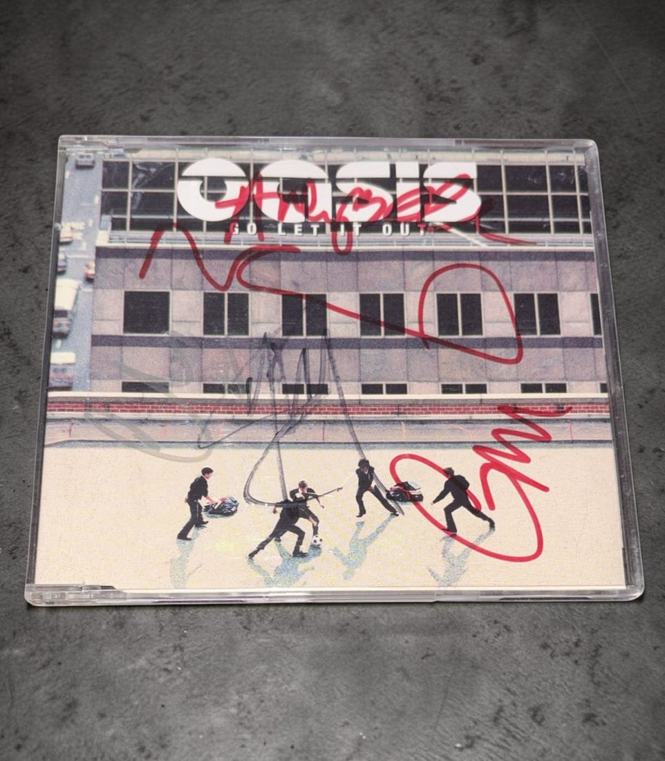 Oasis Signed CD Single: This lot is a CD Single (Go Let It Out), autographed by Noel Gallagher, Liam Gallagher, Andy Bell, Gem Archer and Alan White of Oasis. Item comes with third party authentication including interactive 