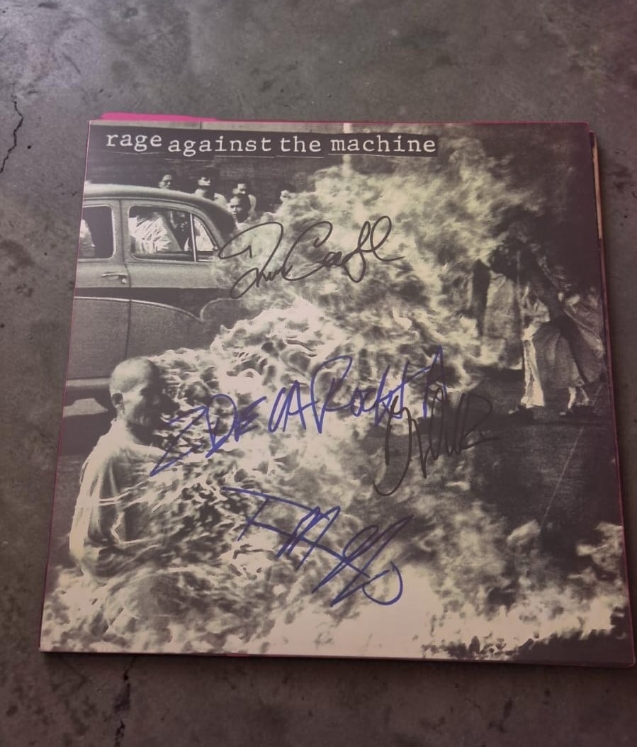 Rage Against The Machine Signed Vinyl LP: This lot is a vinyl LP, autographed by Zack De La Rocha, Tom Morello, Tim Commerford and Brad Wilk of Rage Against The Machine. If you wish to upgrade to a third party authentication with holographic 