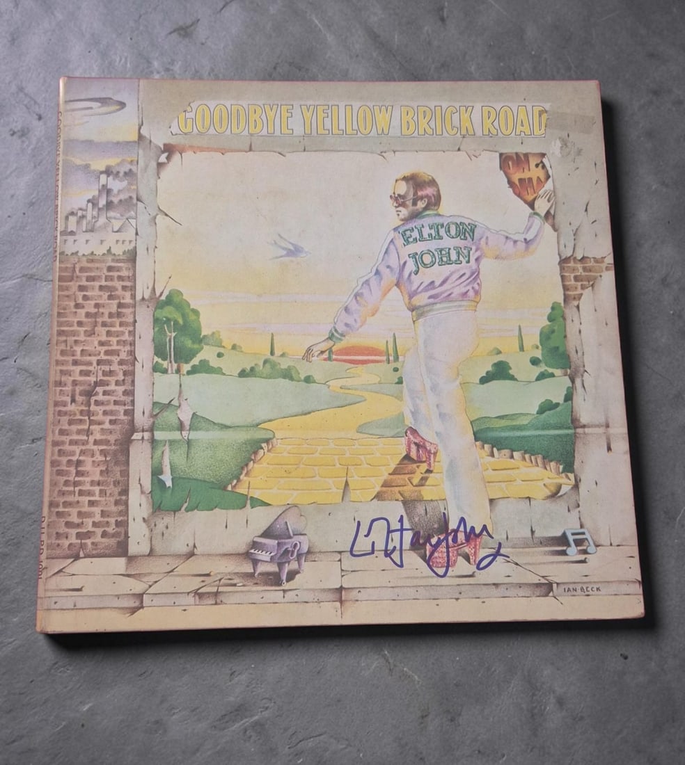 Elton John Goodbye Yellow Brick Road Signed Vinyl LP: This lot is a vinyl LP (Goodbye Yellow Brick Road), autographed by Elton John. If you wish to upgrade to a third party authentication with holographic QR code and item scoring, an additional charge of
