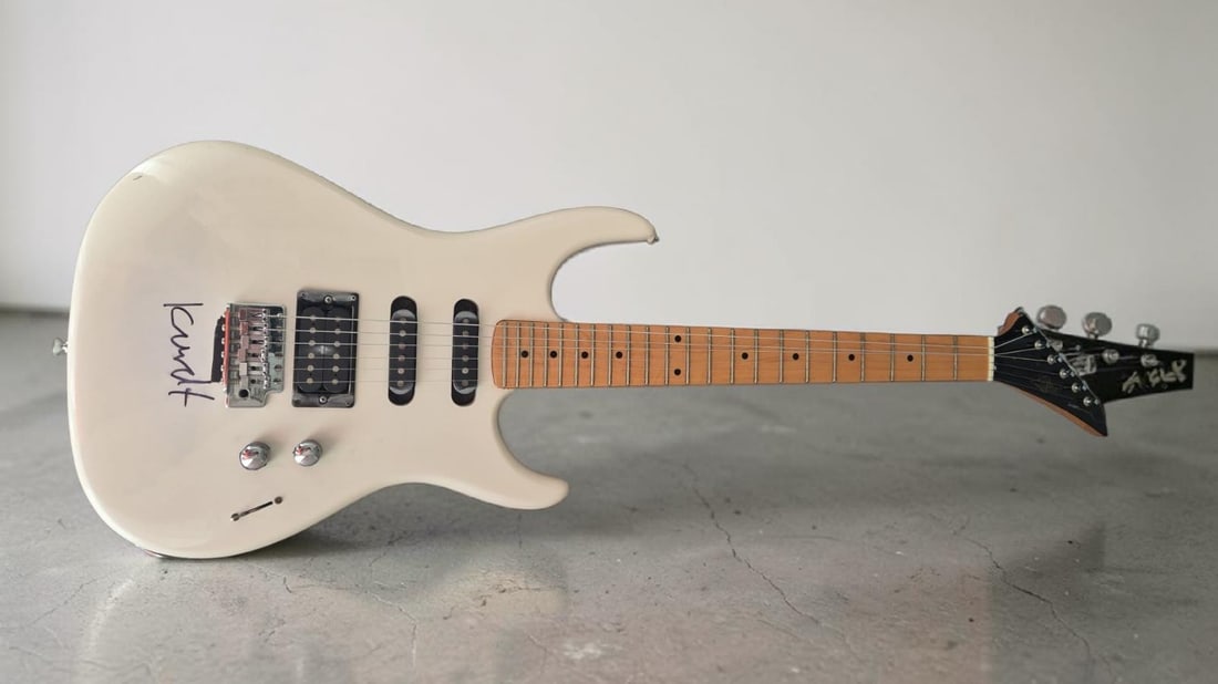 Kurt Cobain Nirvana Signed Electric Guitar: This lot is an electric guitar, autographed on the body by Kurt Cobain of Nirvana. The guitar was signed in Scotland in 1992 by Kurt Cobain. Item comes with letter of authenticity from the person who 