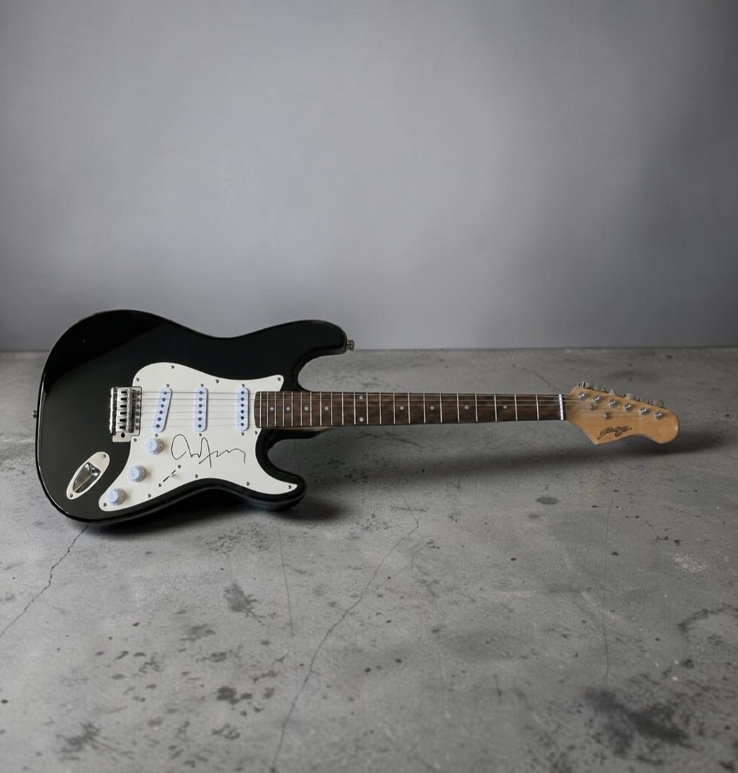 Brian Ferry Roxy Music Signed Stratocaster Style Electric Guitar: This lot is a Stratocaster style electric guitar, autographed by Brian Ferry of Roxy Music. If you wish to upgrade to a third party authentication with holographic QR code and item scoring, an