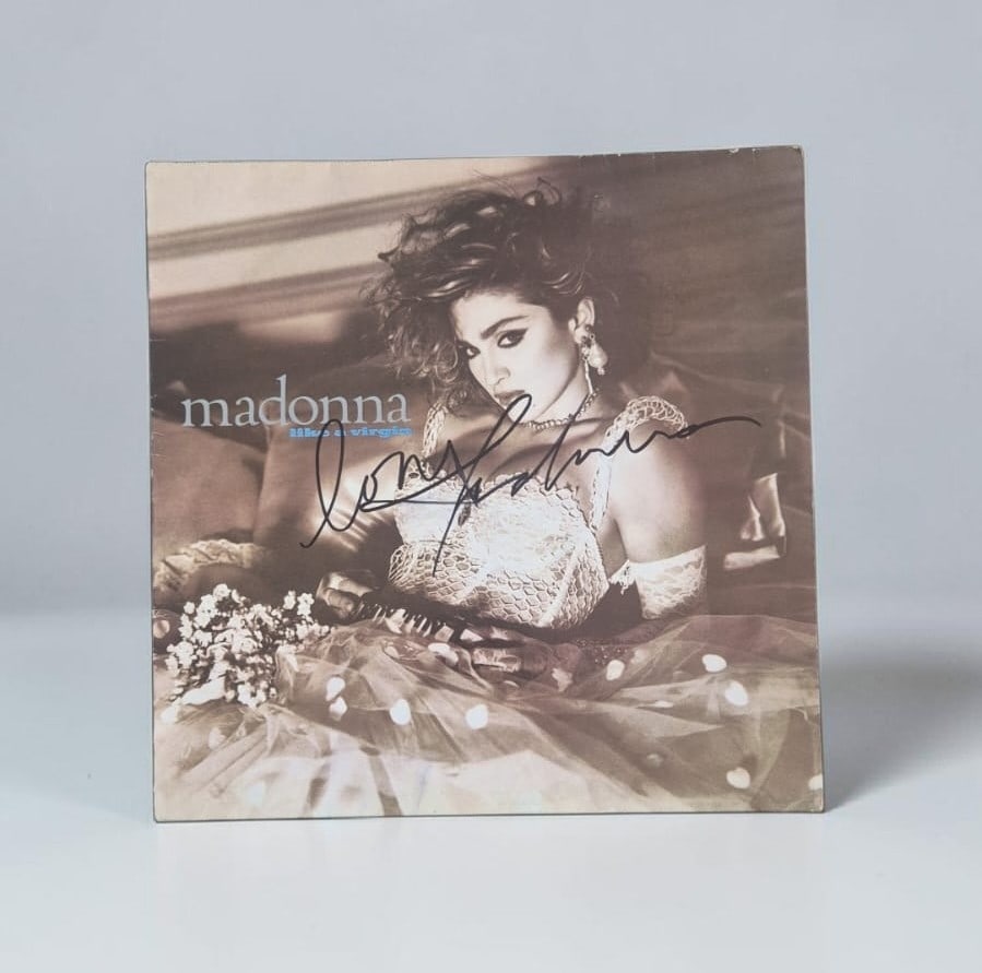 Madonna Signed Like A Virgin Vinyl LP: This lot is a vinyl LP (Like A Virgin), autographed on the front of the vinyl cover by Madonna. If you wish to upgrade to a third party authentication with holographic QR code and item scoring, an add