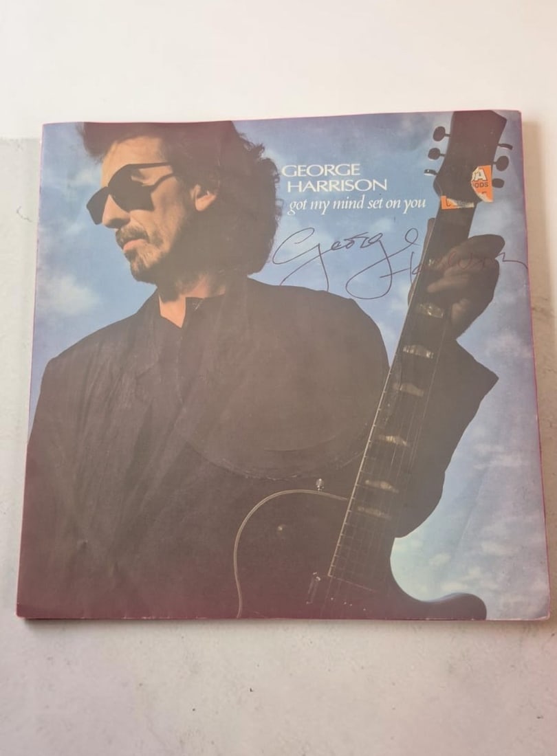 George Harrison The Beatles Got My Mind Set On You Signed Vinyl LP: This lot is a vinyl LP (Got My Mind Set On You), autographed by George Harrison of The Beatles. If you wish to upgrade to a third party authentication with holographic QR code and item scoring, an add