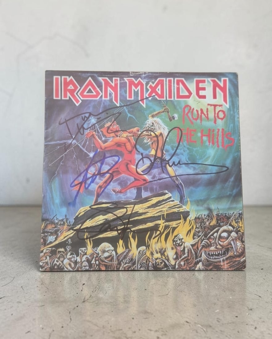 Iron Maiden Run To The Hills Signed 7" Vinyl: This lot is a 7" vinyl (Run To The Hills), autographed on the front of the vinyl cover by Bruce Dickinson, Steve Harris, Adrian Smith and Dave Murray of Iron Maiden. If you wish to upgrade to a third 