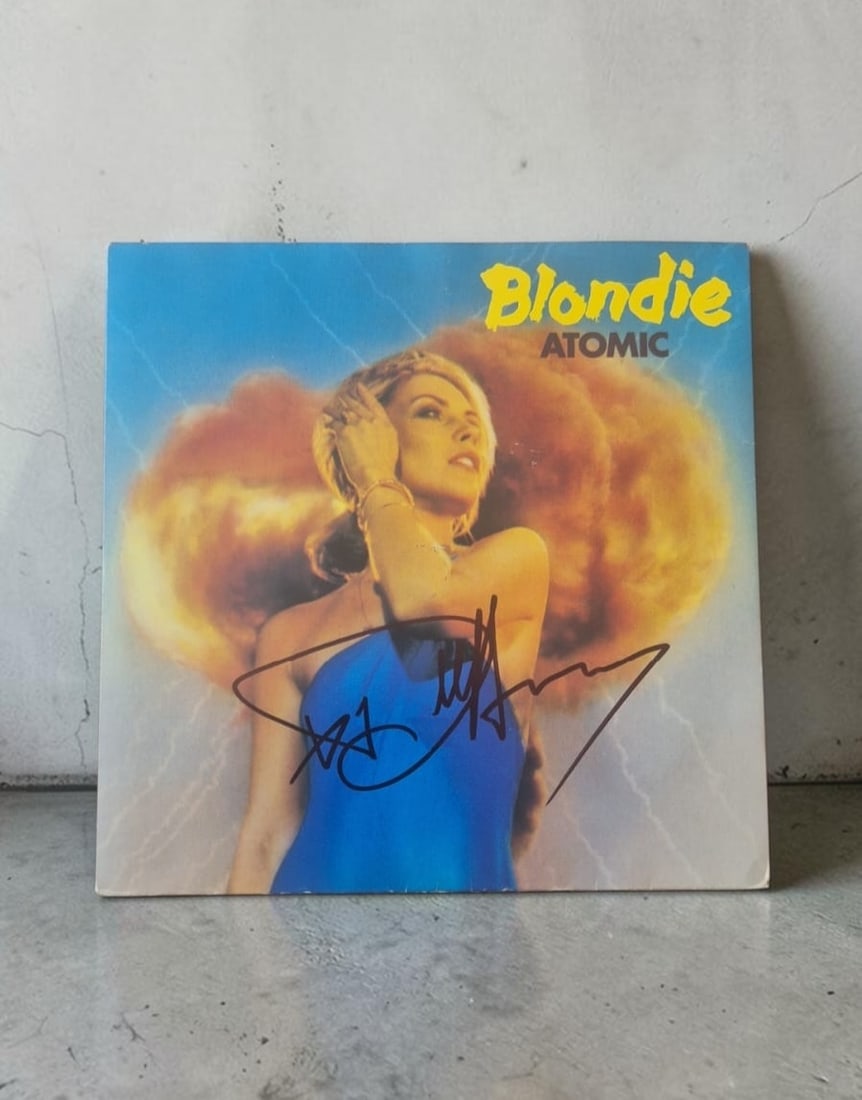 Debbie Harry Blondie Atomic Signed 7" Vinyl: This lot is a 7" vinyl (Atomic), autographed on the front of the vinyl cover by Debbie Harry of Blondie. If you wish to upgrade to a third party authentication with holographic QR code and item scorin