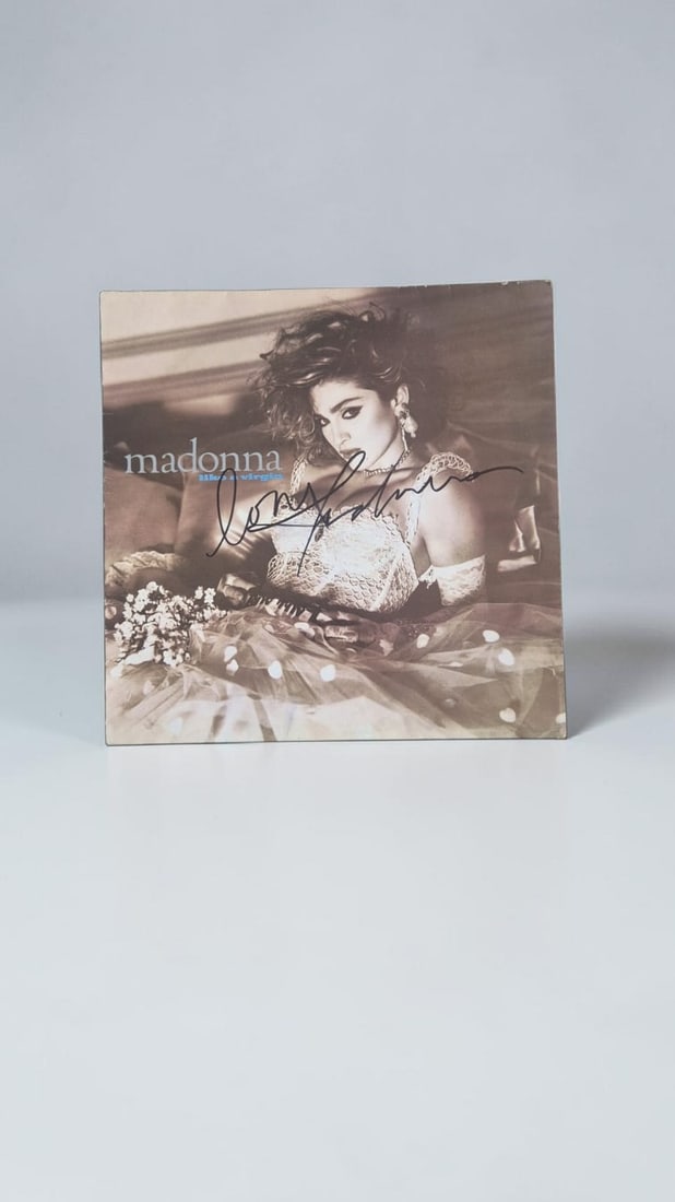Madonna Signed Like A Virgin Vinyl LP: This lot is a vinyl LP (Like A Virgin), autographed on the front of the vinyl cover by Madonna. If you wish to upgrade to a third party authentication with holographic QR code and item scoring, an add