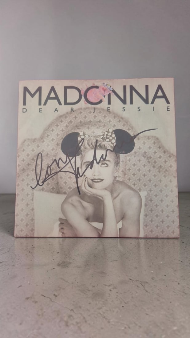 Madonna Dear Jessie Signed Vinyl 45: This lot is a vinyl 45 (Dear Jessie), autographed by Madonna. If you wish to upgrade to a third party authentication with holographic QR code and item scoring, an additional charge of 30 UK Pound woul