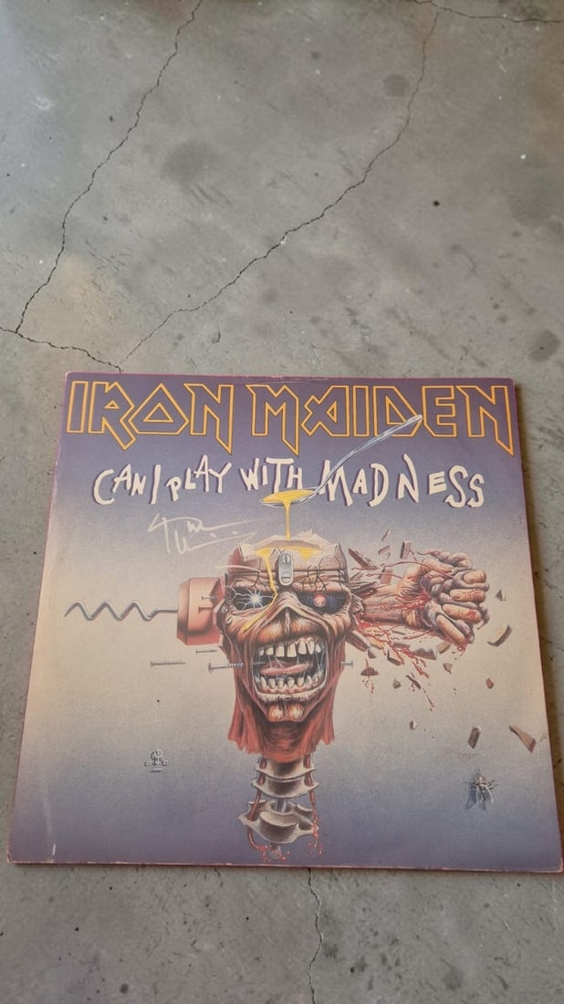 Bruce Dickinson Iron Maiden Can I Play With Madness Signed 12" Vinyl: This lot is a 12" vinyl (Can I Play With Madness), autographed by Bruce Dickinson of Iron Maiden. If you wish to upgrade to a third party authentication with holographic QR code and item scoring, an a