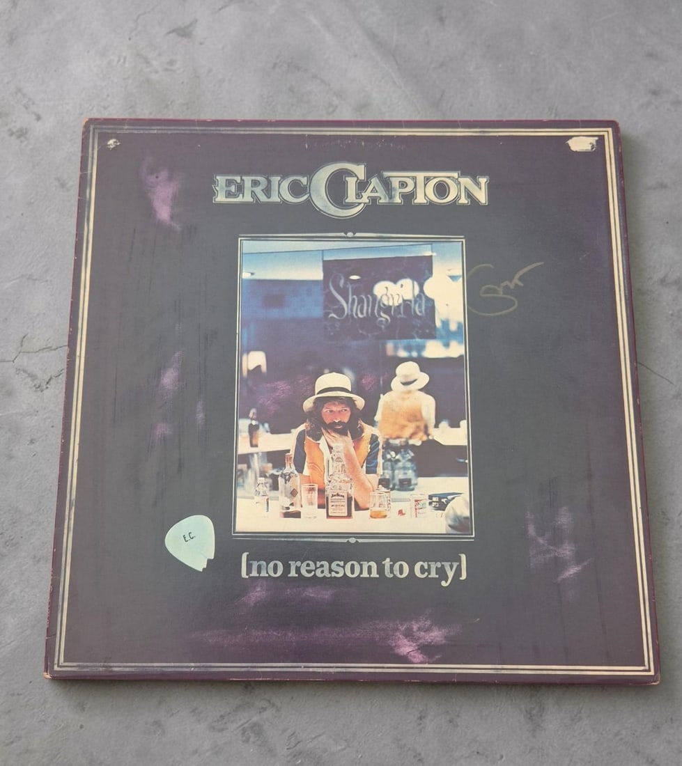 Eric Clapton No Reason To Cry Signed Vinyl LP: This lot is a vinyl LP (No Reason To Cry), autographed by Eric Clapton. If you wish to upgrade to a third party authentication with holographic QR code and item scoring, an additional charge of 30 UK 