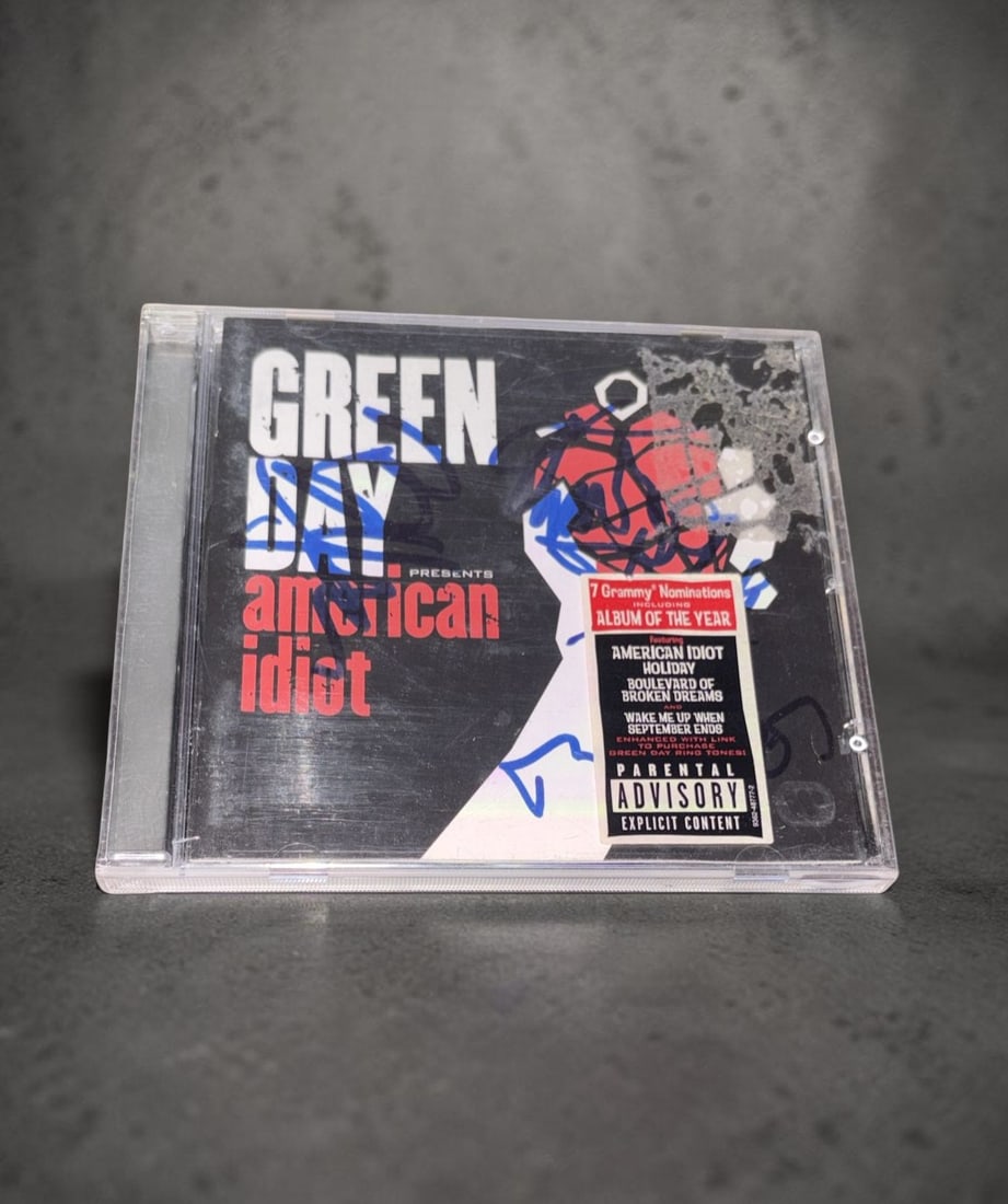 Green Day Signed CD: This lot is CD (American Idiot), autographed by Billy Joe Armstrong, Tre Cool and Mike Dirnt of Green Day. If you wish to upgrade to a third party authentication with holographic QR code and item