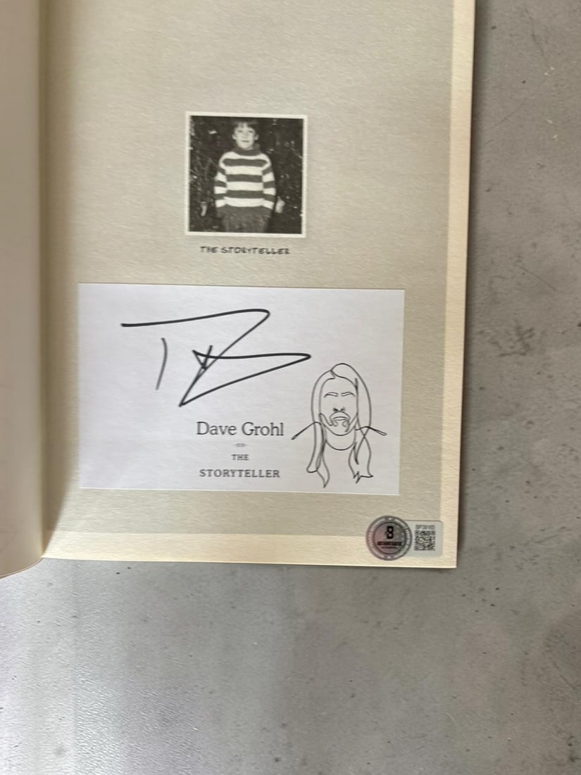 Dave Grohl Foo Fighters And Nirvana Signed The Storyteller Hardback Book Beckett BAS Authentication: This lot is a hardback book (The Storyteller), autographed on the inside page by Dave Grohl of Foo Fighters and Nirvana. Beckett BAS Authentication. If you wish to upgrade to a third party authenticat