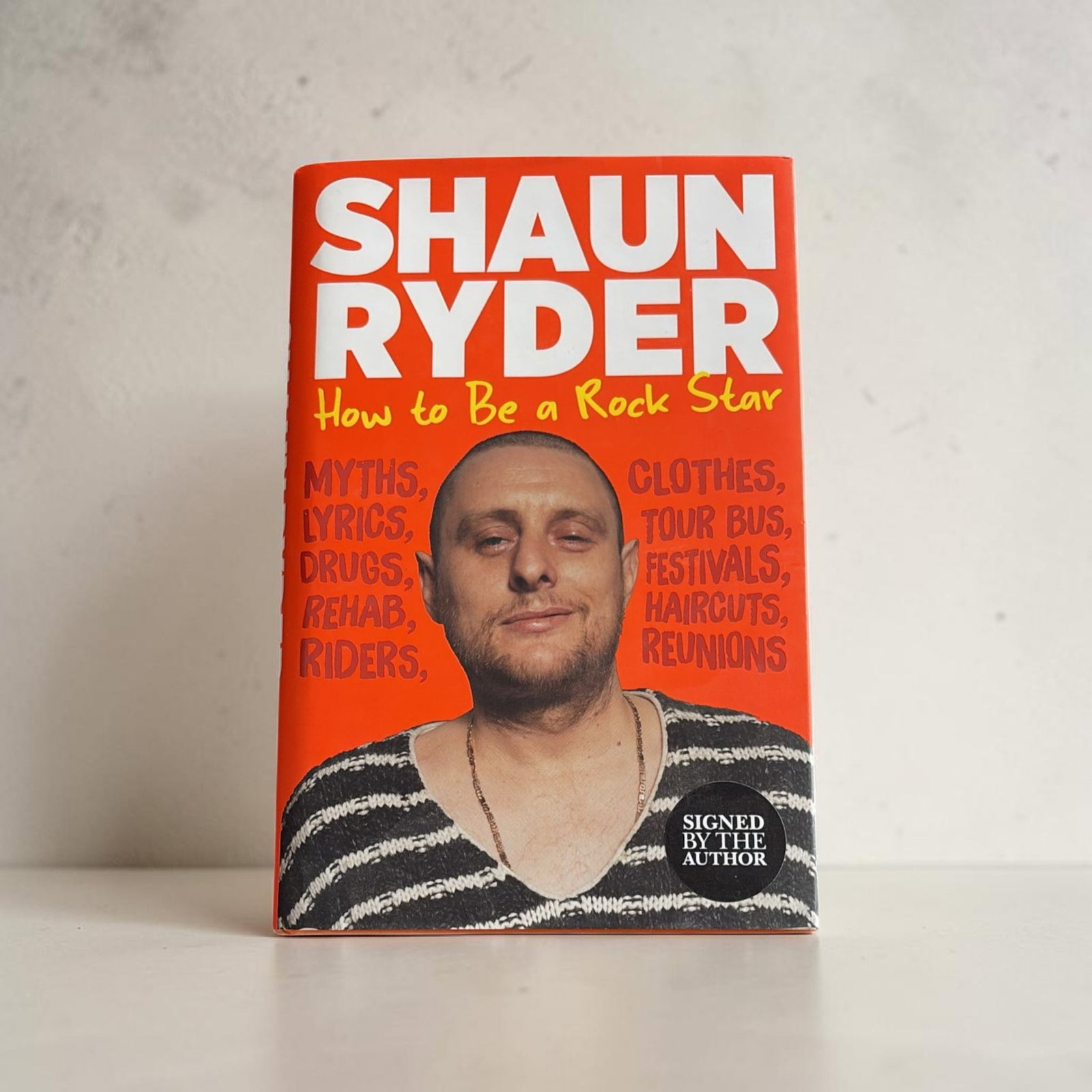Shaun Ryder Signed Hardback Book: This lot is a hardback book (How To Be A Rockstar), autographed by Shaun Ryder. If you wish to upgrade to a third party authentication with holographic QR code and item scoring, an additional charge