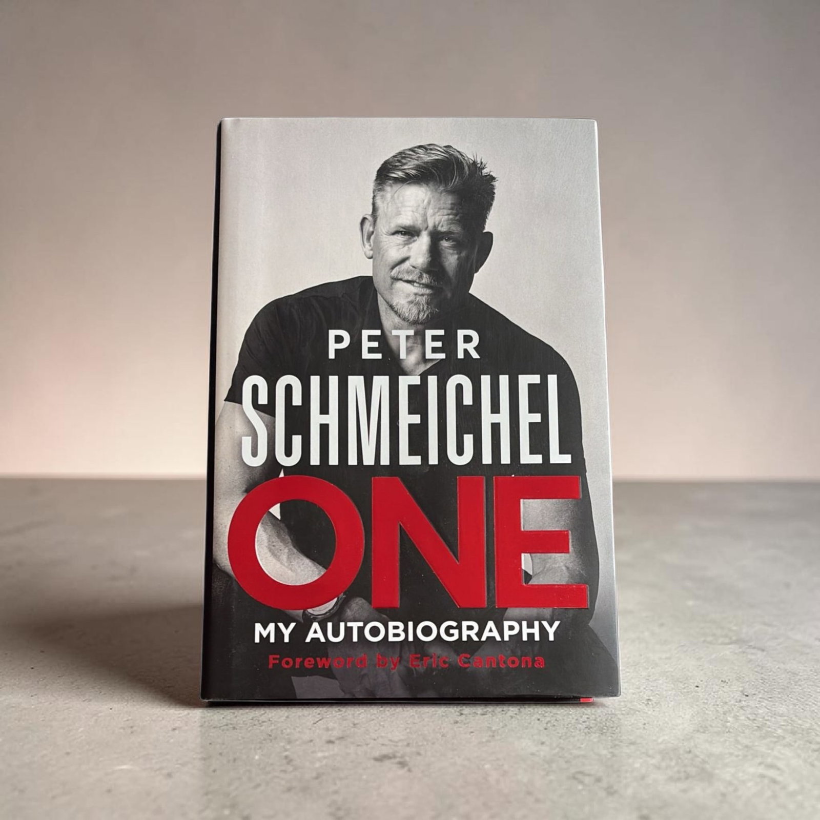 Peter Schmeichel Signed Hardback Book: This lot is a hardback book (One), autographed by Peter Schmeichel. If you wish to upgrade to a third party authentication with holographic QR code and item scoring, an additional charge of 30 UK