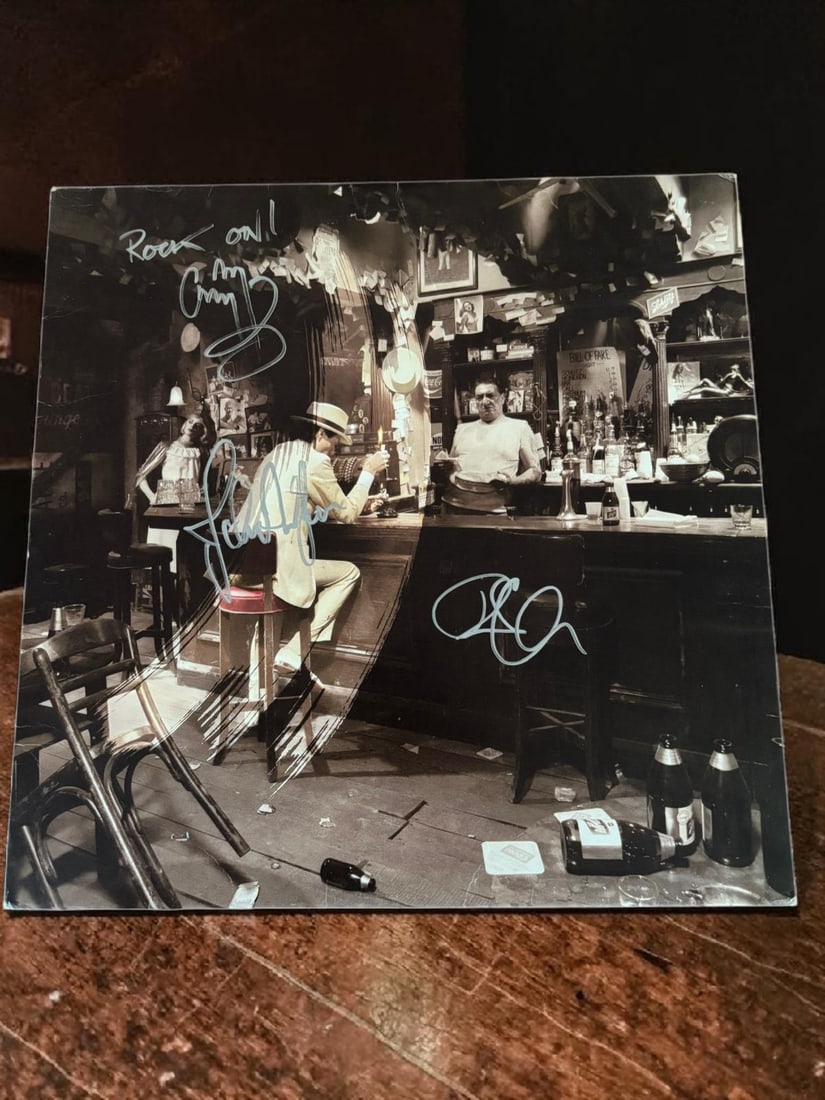 Led Zeppelin Signed Vinyl LP: This lot is a vinyl LP (In Through The Outdoor), autographed by Robert Plant, Jimmy Page and John Paul Jones of Led Zeppelin. If you wish to upgrade to a third party authentication with holographic
