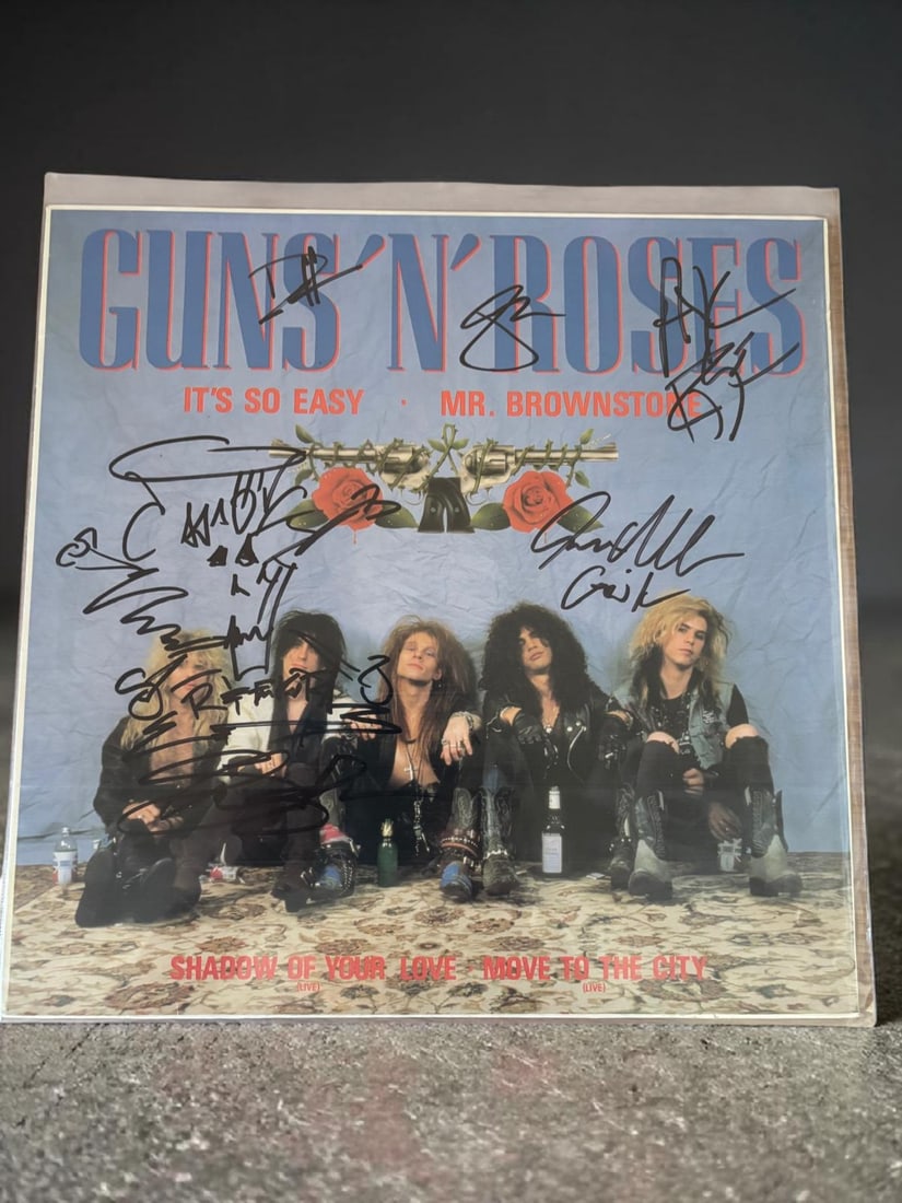 Guns N' Roses Signed 12" Vinyl: This lot is a 12" vinyl (It's So Easy Mr Brownstone), autographed by Axl Rose, Slash, Duff McKagan, Izzy Stradlin and Steven Adler of Guns N' Roses. If you wish to upgrade to a third party