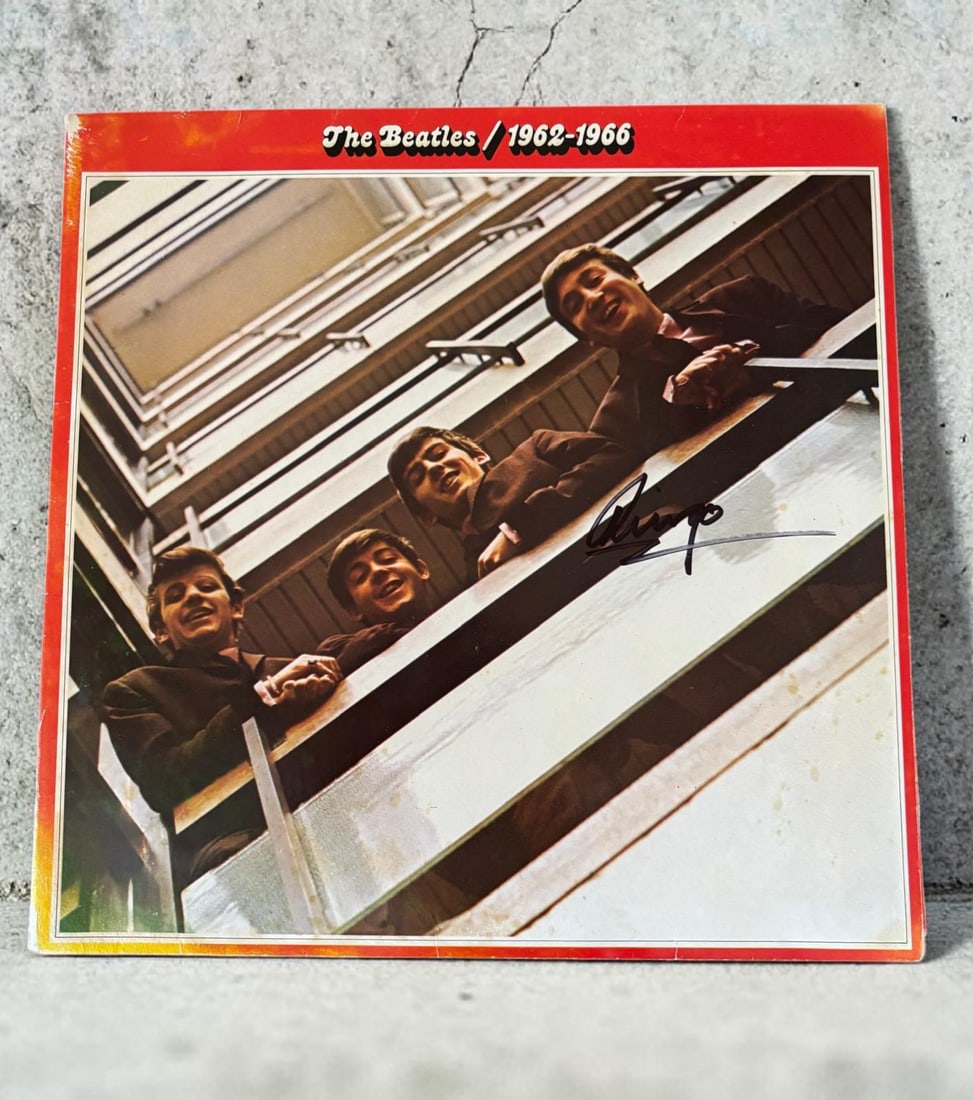 Ringo Starr The Beatles Signed Vinyl LP: This lot is a vinyl LP (The Beatles 1962 to 1966), autographed by Ringo Starr of The Beatles. If you wish to upgrade to a third party authentication with holographic QR code and item scoring, an