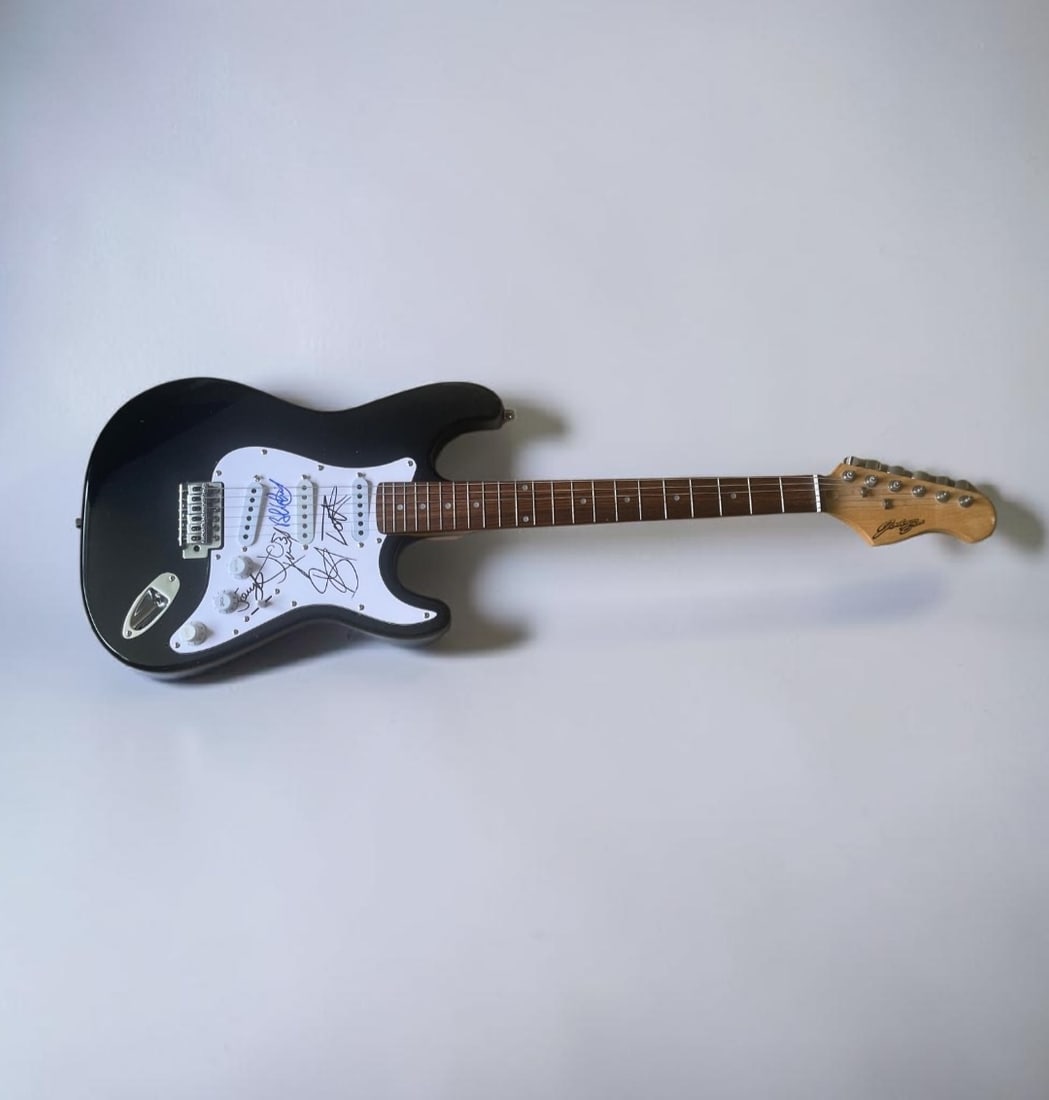 Aerosmith Signed Electric Guitar: This lot is an electric guitar, autographed by Steven Tyler, Joe Perry, Joey Kramer, Brad Whitford and Tom Hamilton of Aerosmith. If you wish to upgrade to a third party authentication with
