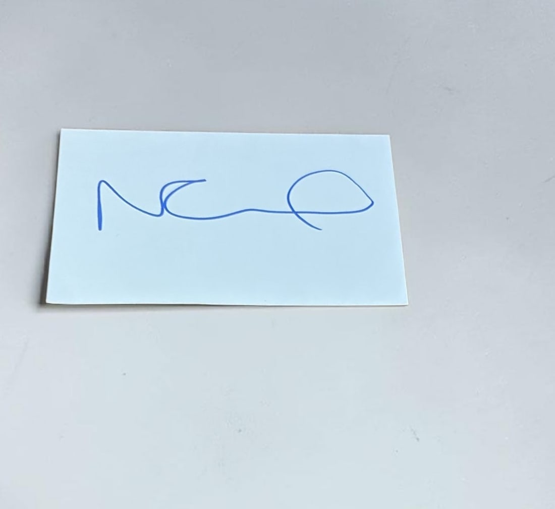 Noel Gallagher Oasis Signed Card: This lot is a card, autographed by Noel Gallagher of Oasis. If you wish to upgrade to a third party authentication with holographic QR code and item scoring, an additional charge of 30 UK Pound would 