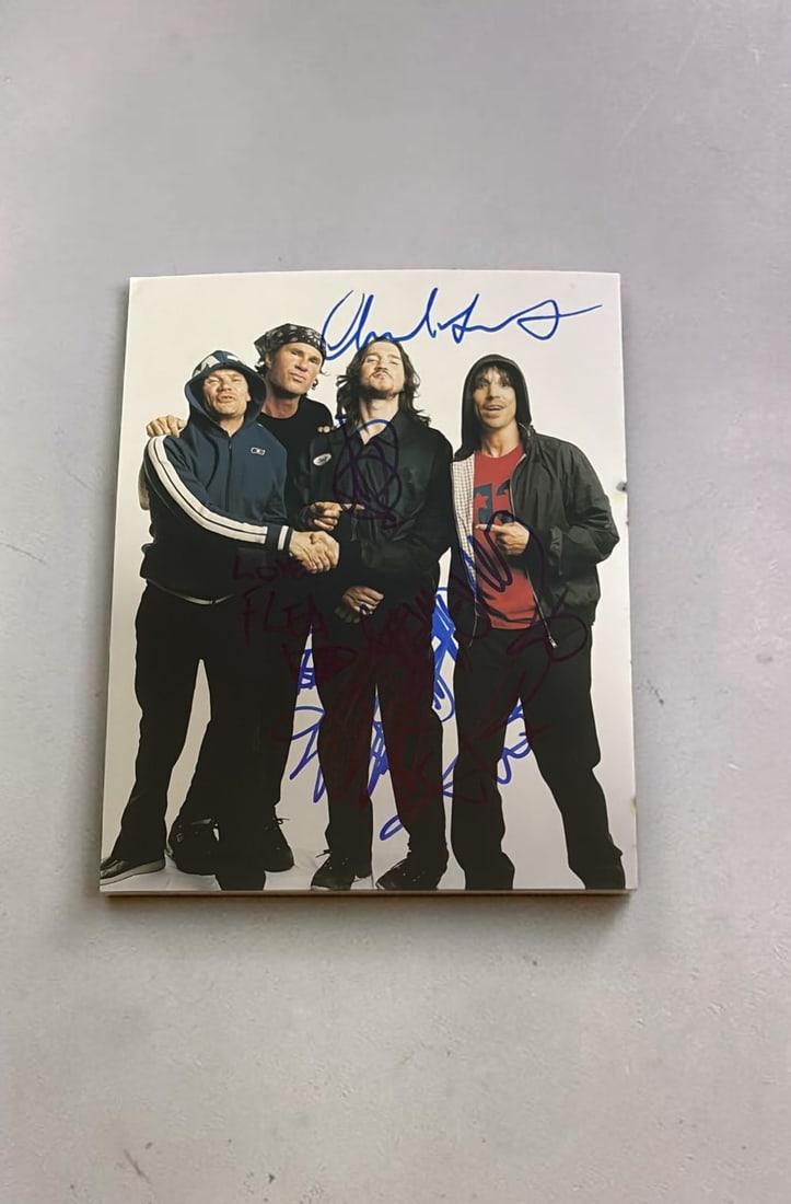 Red Hot Chili Peppers Signed Photograph: This lot is a 10 x 8" photograph, autographed by Chad Smith, John Frusciante, Flea and Anthony Kiedis of Red Hot Chili Peppers. If you wish to upgrade to a third party authentication with holographic 