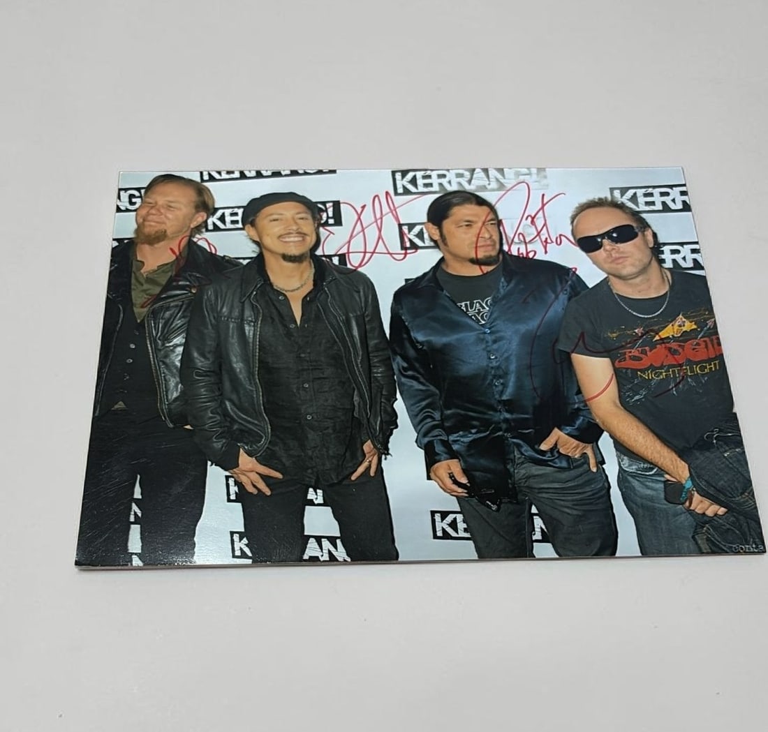 Metallica Signed Photograph: This lot is a 10x8" photograph, autographed by James Hetfield, Lars Ulrich, Kirk Hammett and Robert Trujillo of Metallica. If you wish to upgrade to a third party authentication with holographic QR co