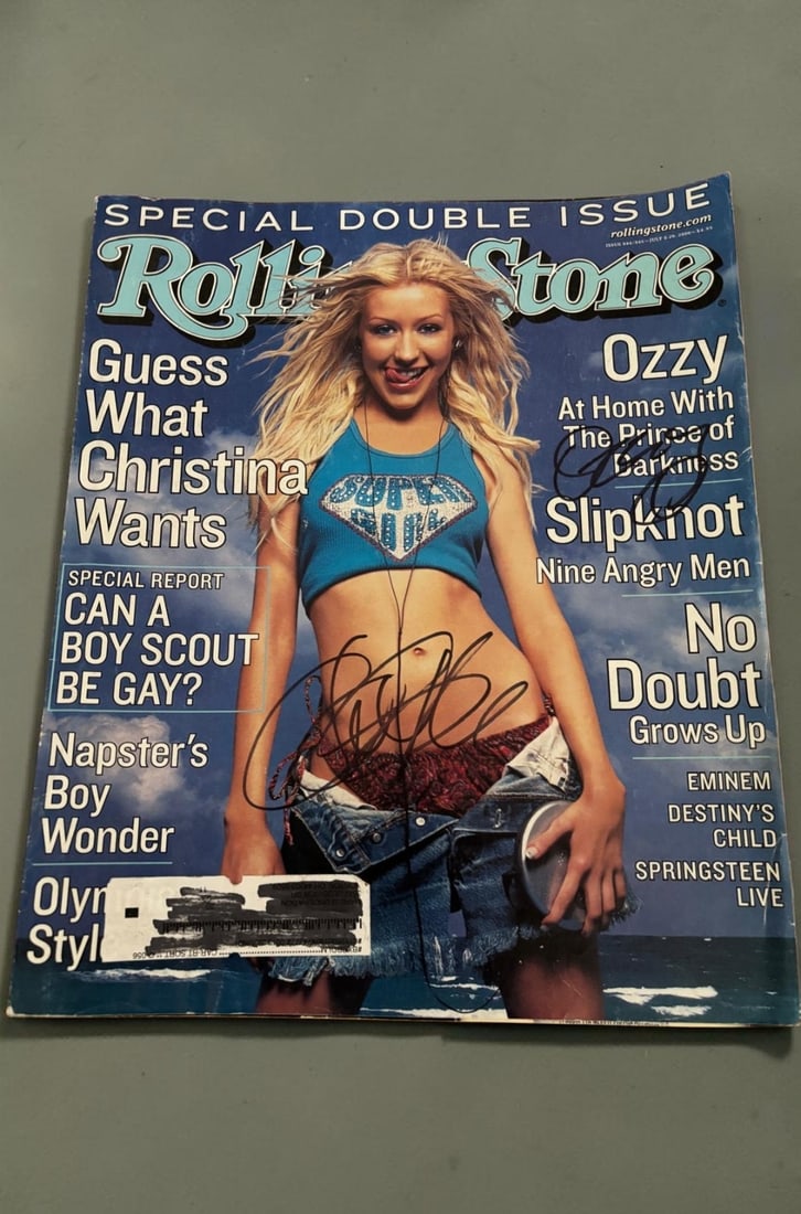 Christina Agulaera and Ozzy Osbourne Signed Magazine: This lot is a Rolling Stones magazine (July 2000), autographed on the front cover by Christina Agulaera and Ozzy Osbourne. If you wish to upgrade to a third party authentication with holographic QR