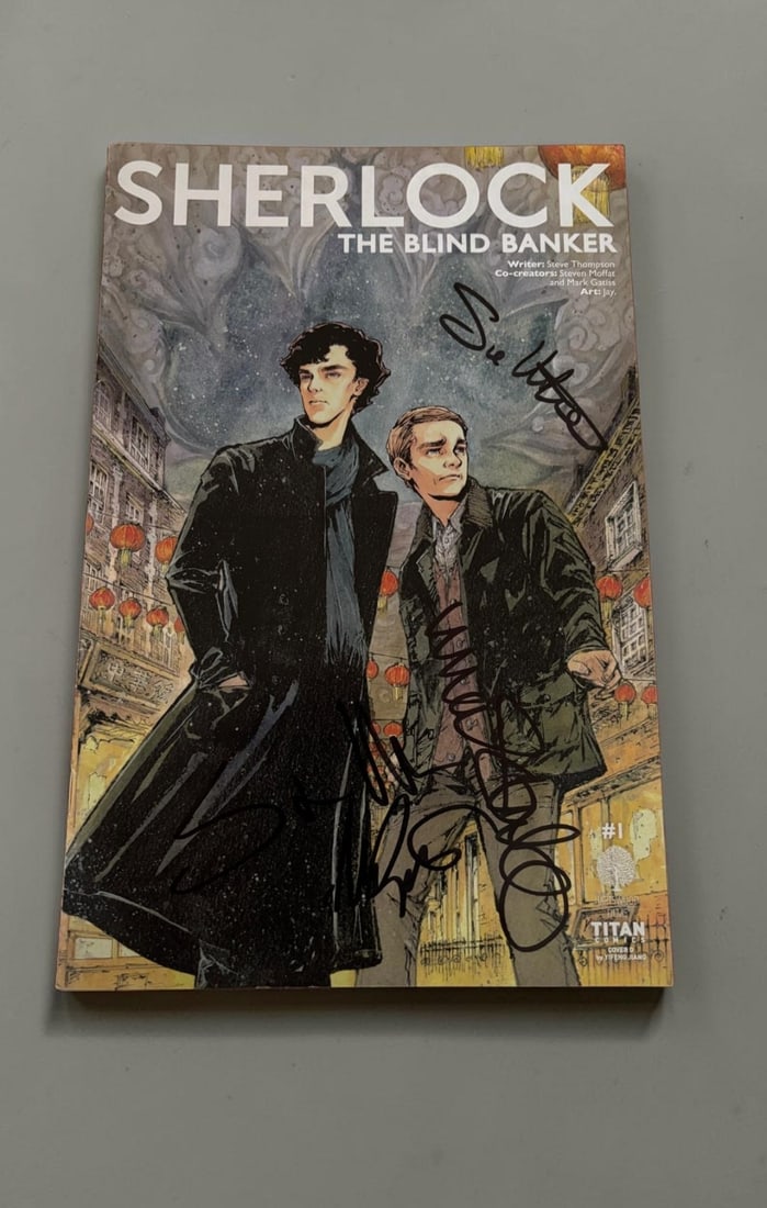 Sue Vertue, Mark Gatiss And Steven Moffat Signed Sherlock Comic: This lot is a Sherlock Comic (The Blind Banker), autographed on the front cover by Sue Vertue, Mark Gatiss and Steven Moffat. If you wish to upgrade to a third party authentication with holographic
