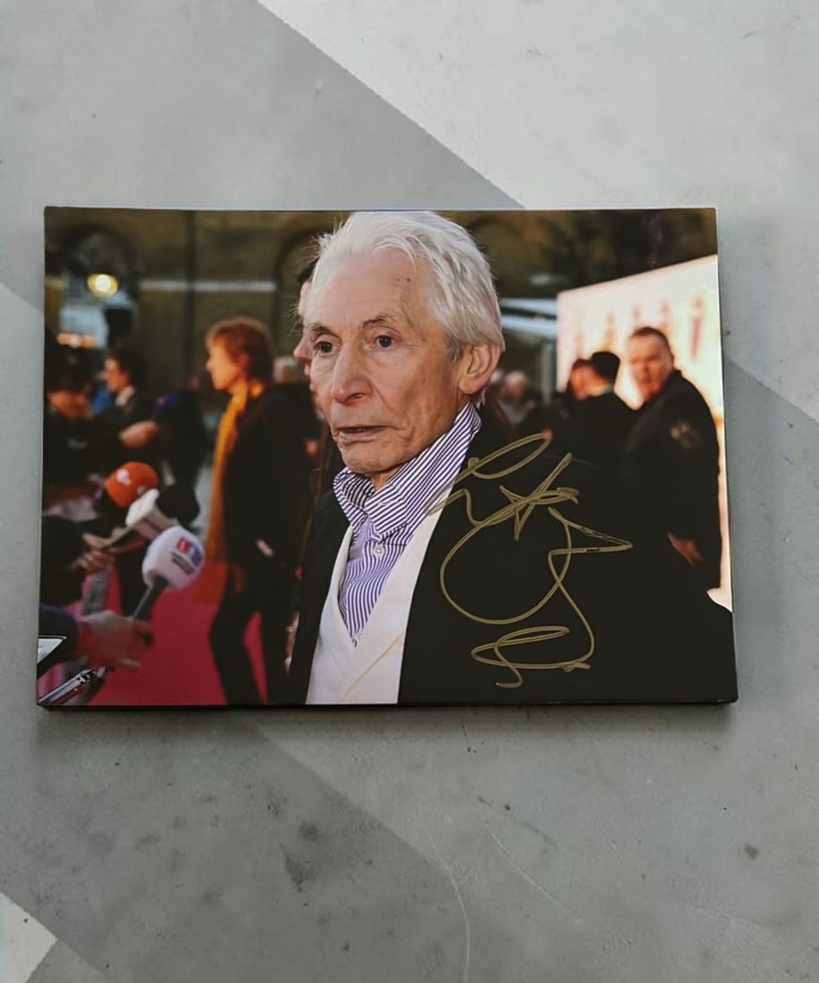 Charlie Watts The Rolling Stones Signed Photograph: This lot is a 7x5" photograph, autographed by Charlie Watts of The Rolling Stones. If you wish to upgrade to a third party authentication with holographic QR code and item scoring, an additional charg